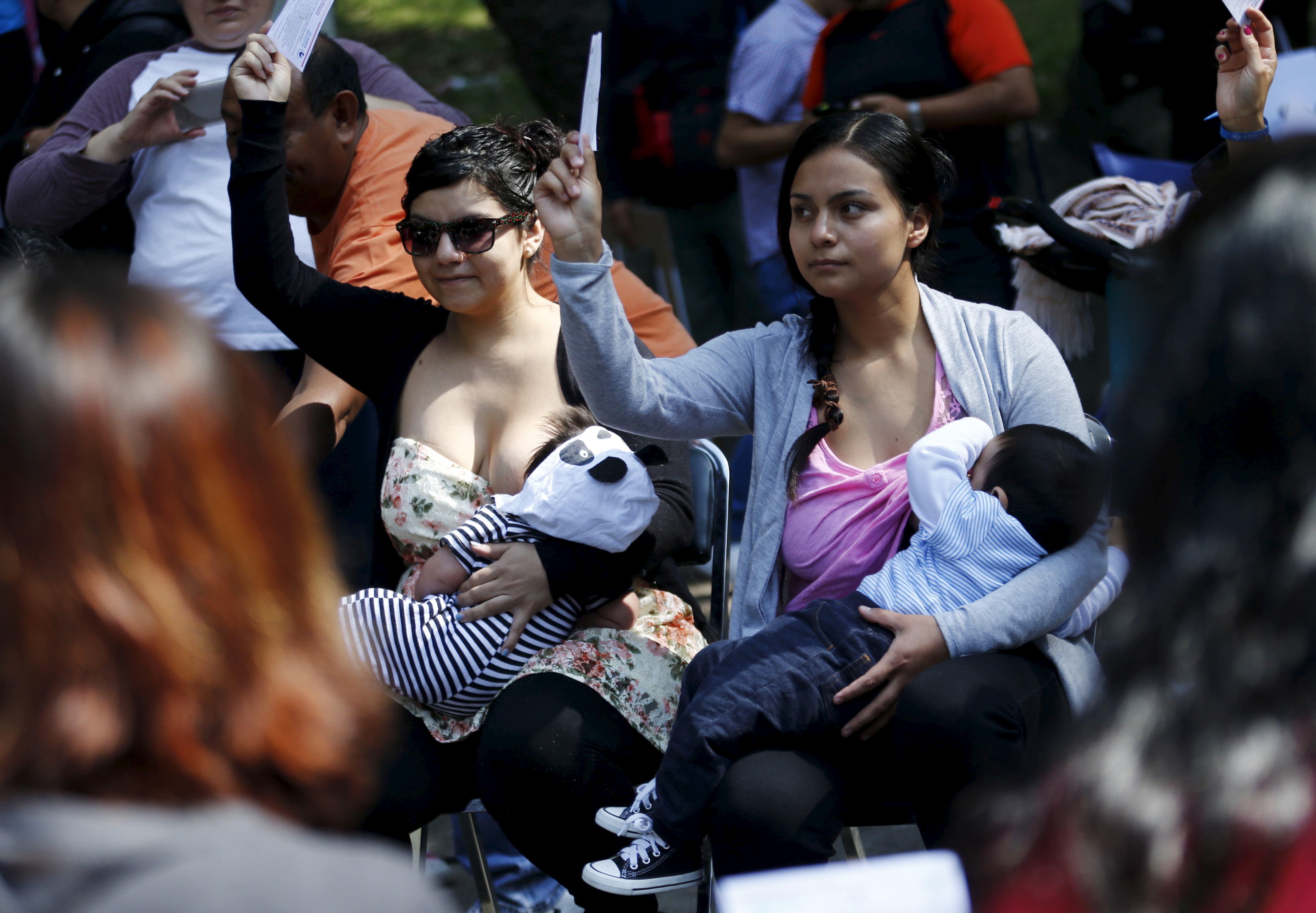 Women breastfeed babies during an event, at Chapultepec Park in Mexico City