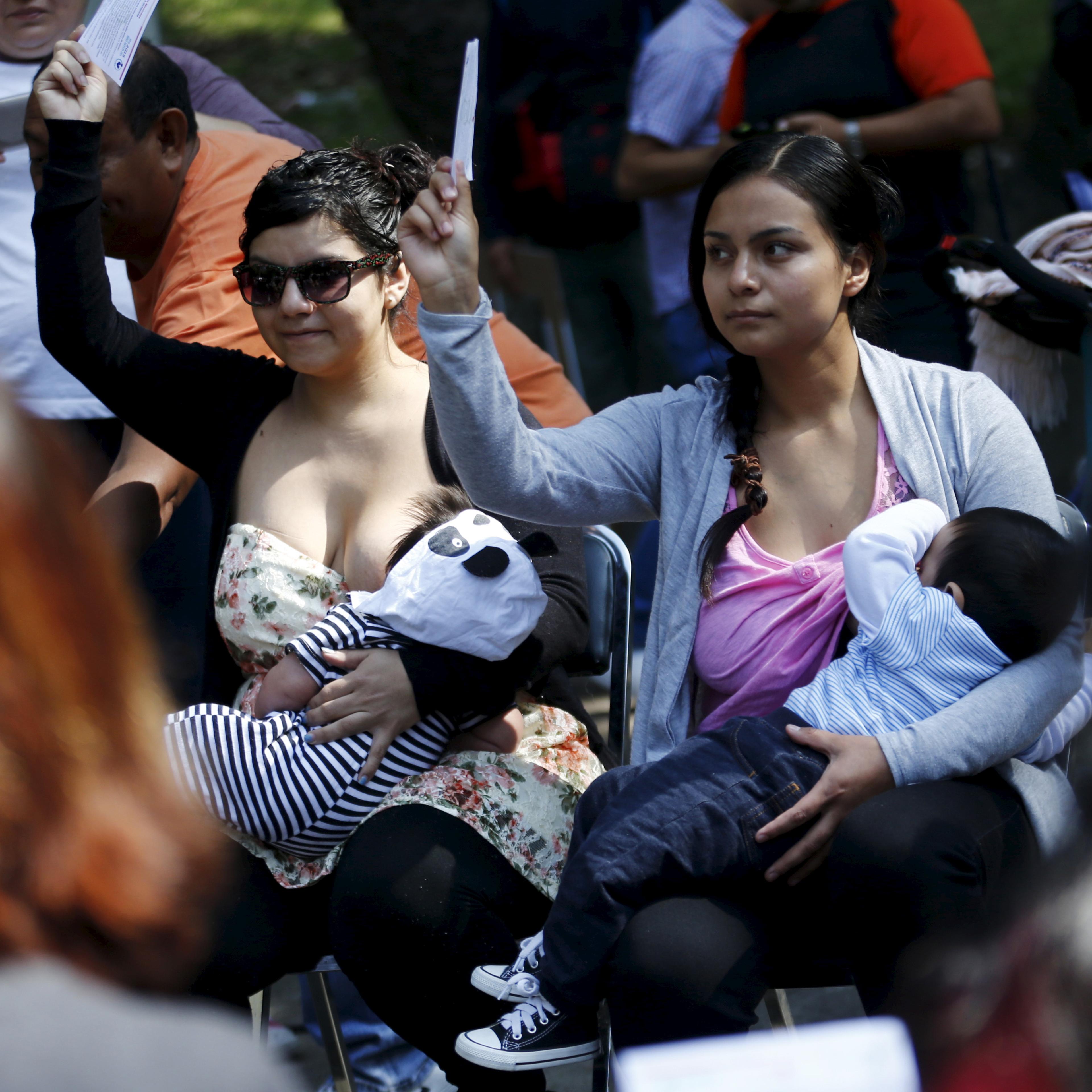 Women breastfeed babies during an event, at Chapultepec Park in Mexico City