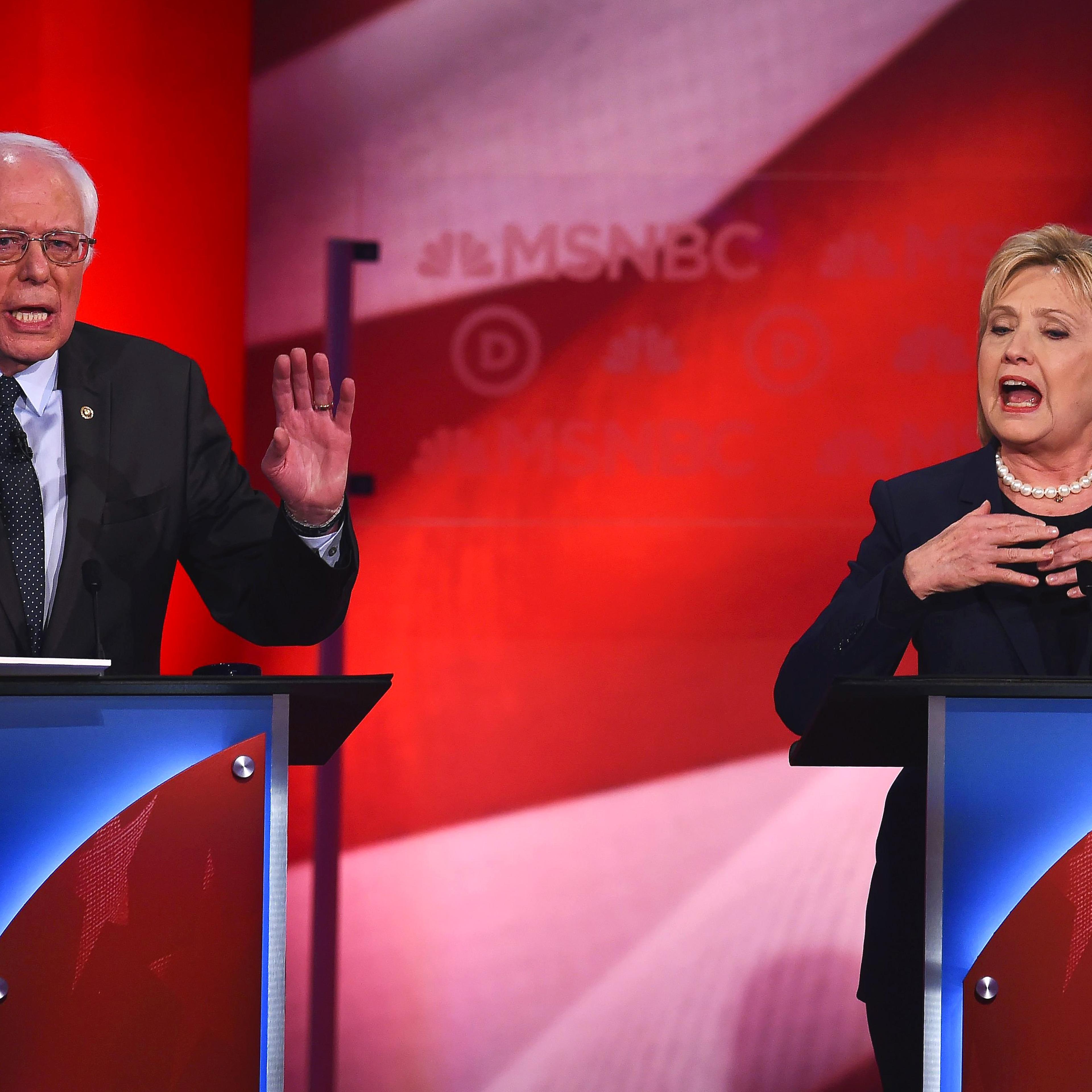 Democratic presidential candidates former Secretary of State Hillary Clinton and U.S. Sen. Bernie Sanders (I-VT) appear at a Democratic debate at the University of New Hampshire on Feb. 4, 2016 in Durham, N.H.
