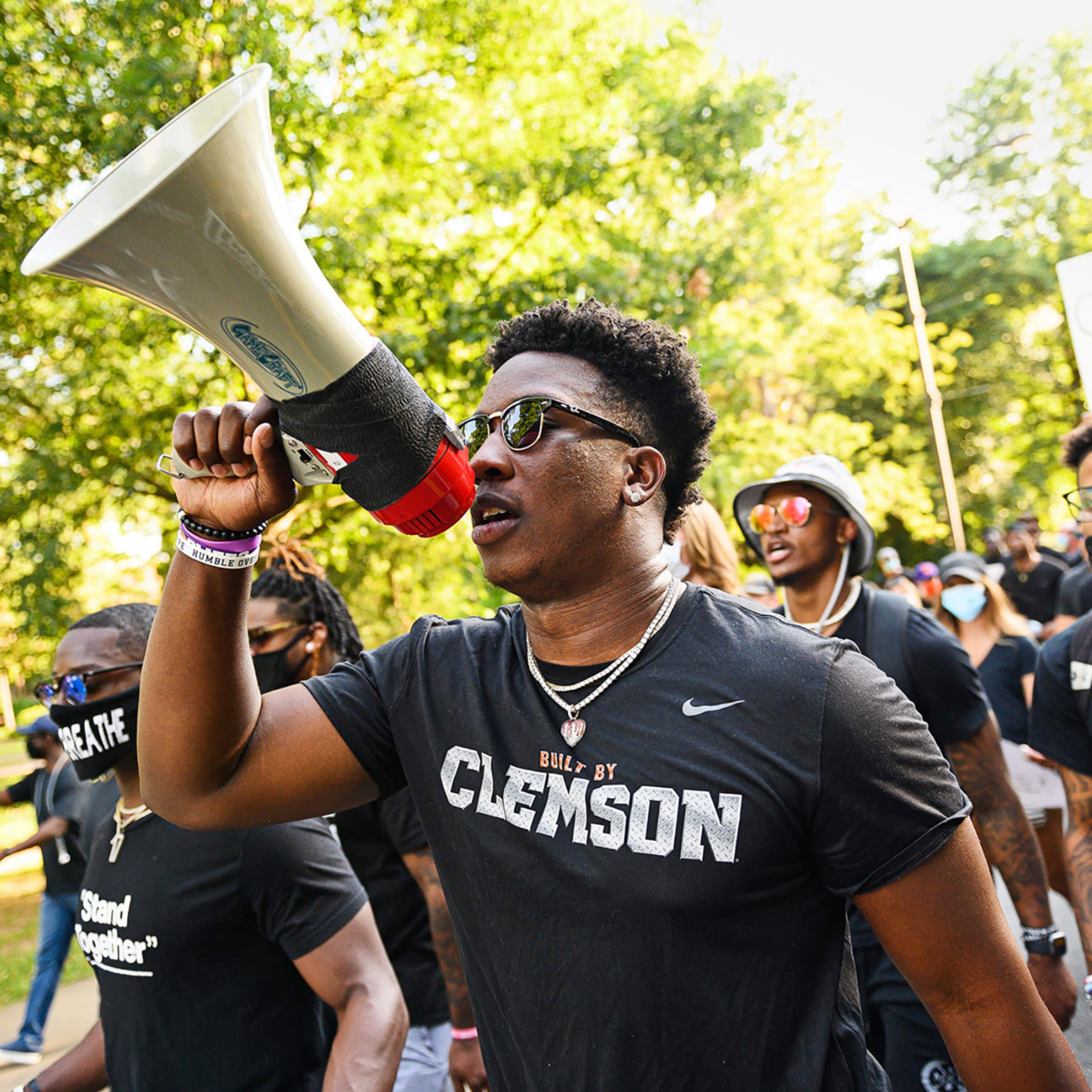 Clemson football player K.J. Henry and teammates lead a Black Lives Matter rally