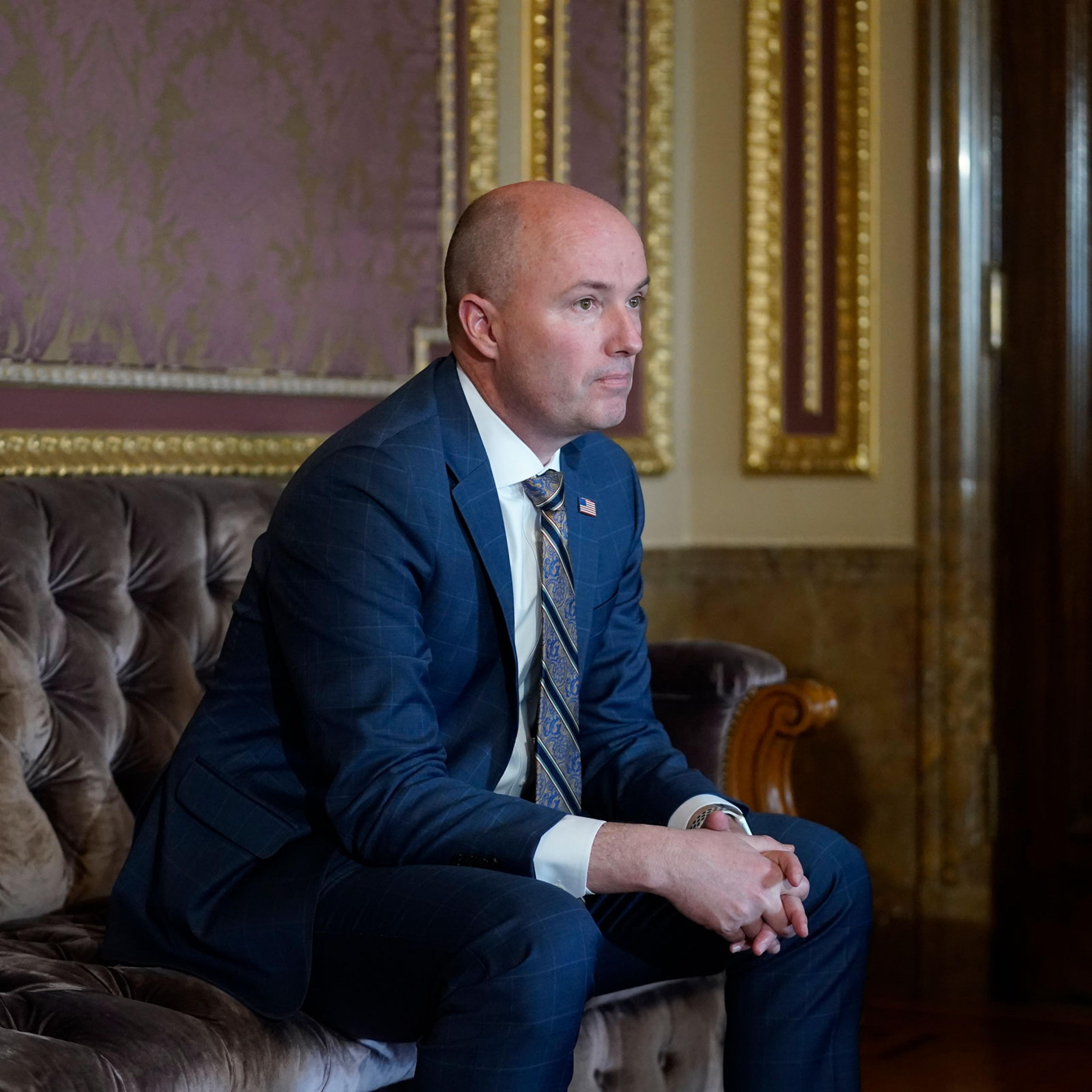 Utah Gov. Spencer Cox looks on during an interview at the Utah State Capitol