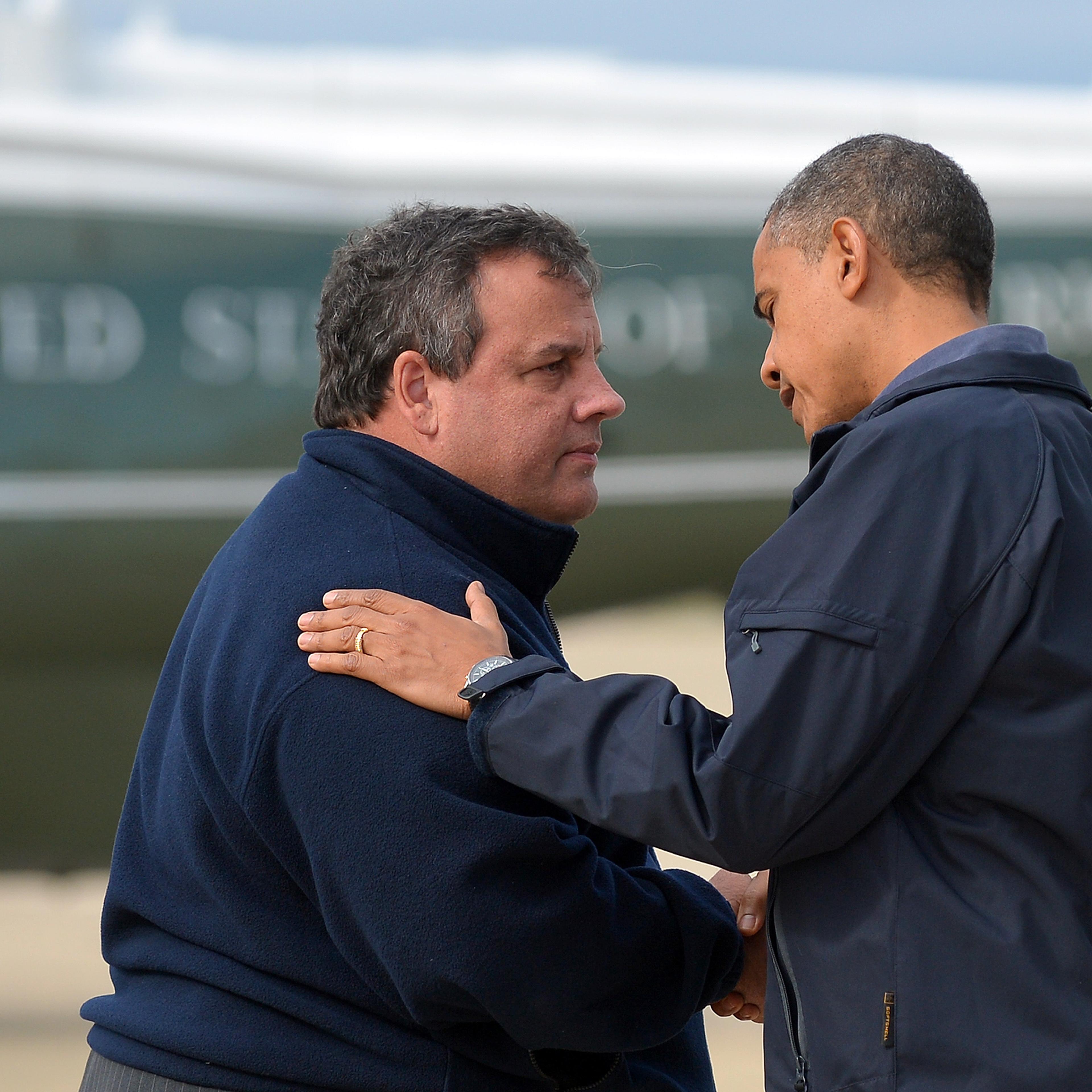 President Barack Obama is greeted by New Jersey Governor Chris Christie upon arriving in Atlantic City, New Jersey, on Oct. 31, 2012 to visit areas hardest hit by the unprecedented cyclone Sandy.