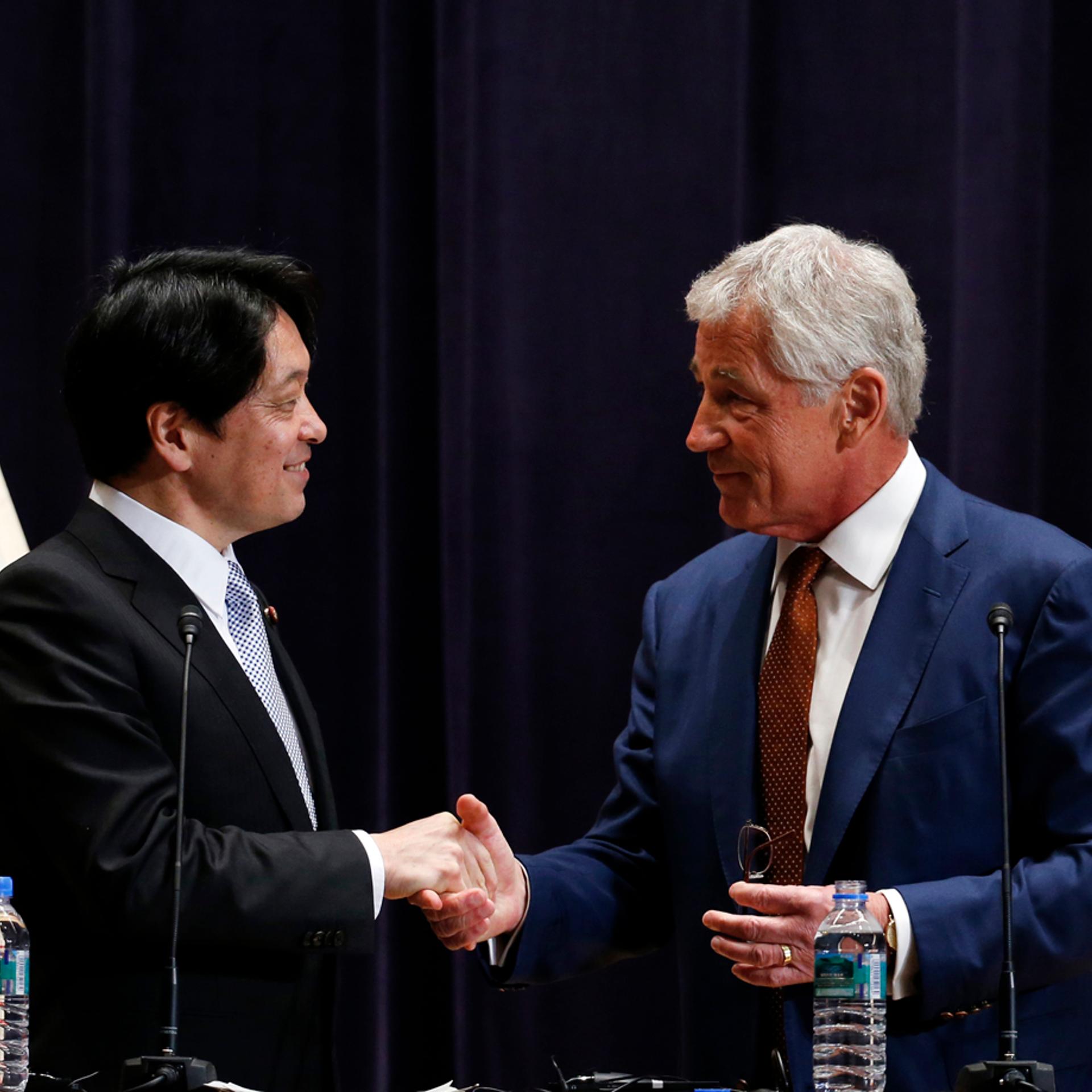From right: U.S. Secretary of Defense Chuck Hagel shakes hands with his Japanese counterpart Itsunori Onodera at the end of their joint news conference at the Defense Ministry in Tokyo on April 6, 2014.