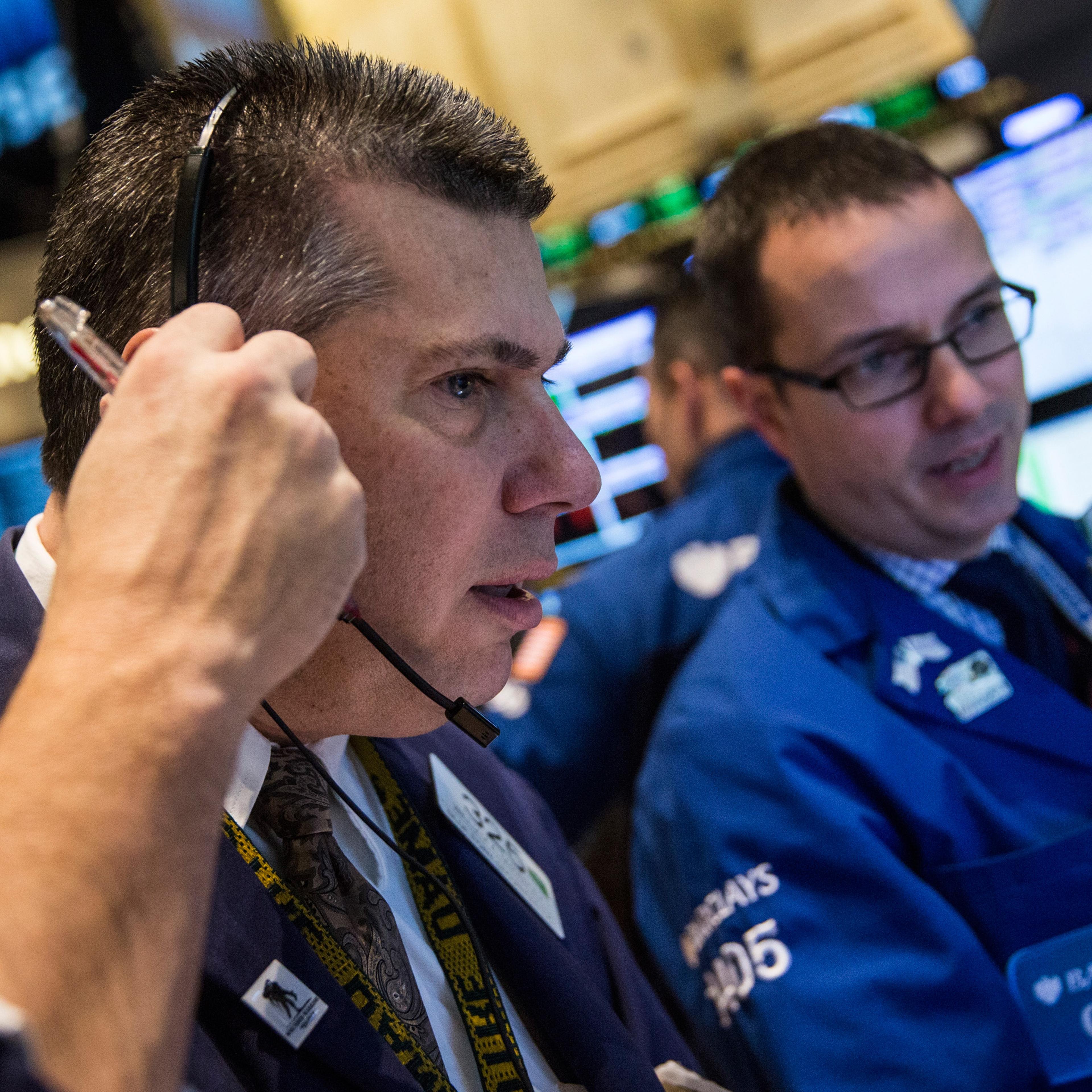 Traders work on the floor of the New York Stock Exchange.