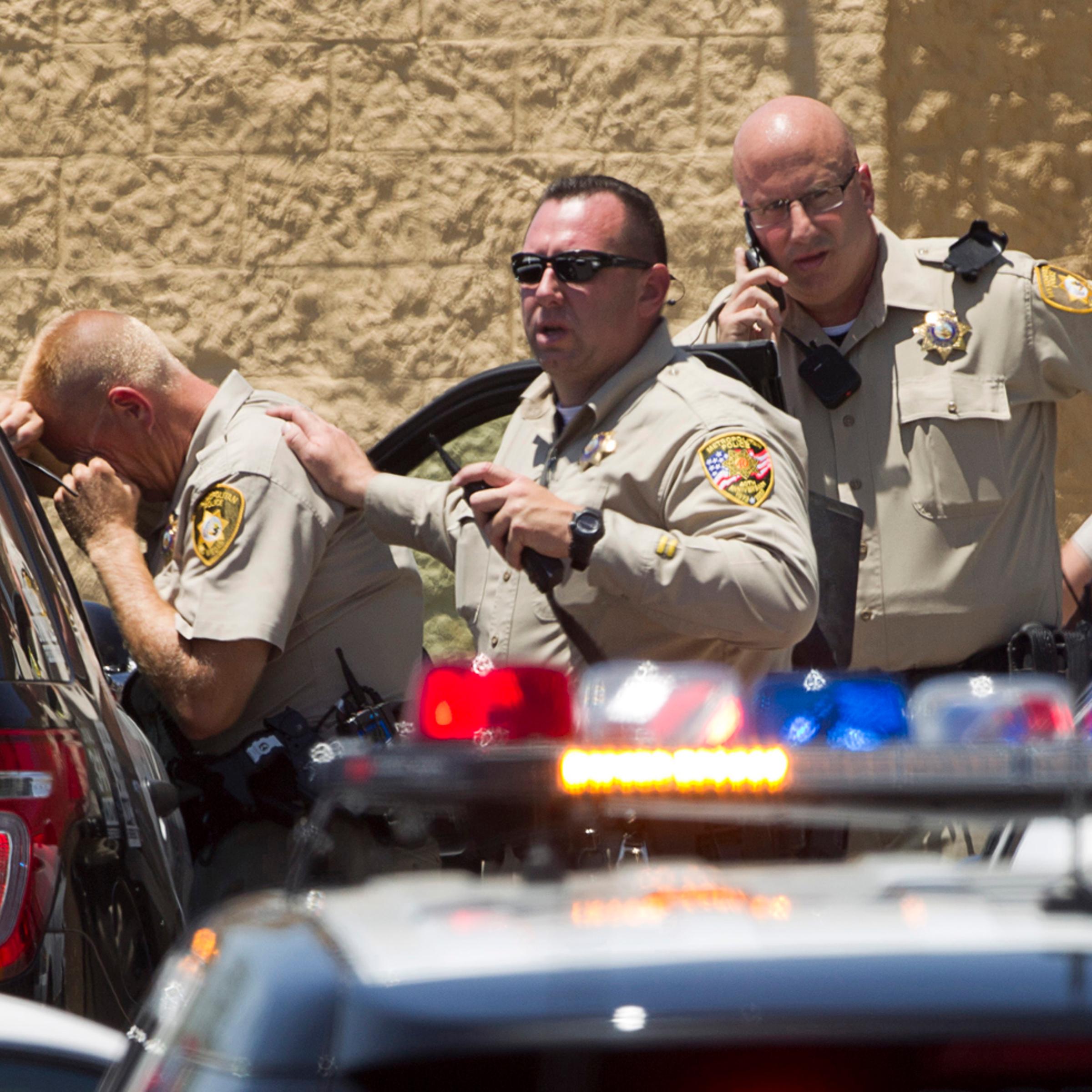 Metro Police officers are shown outside a Wal-Mart after a shooting in Las Vegas