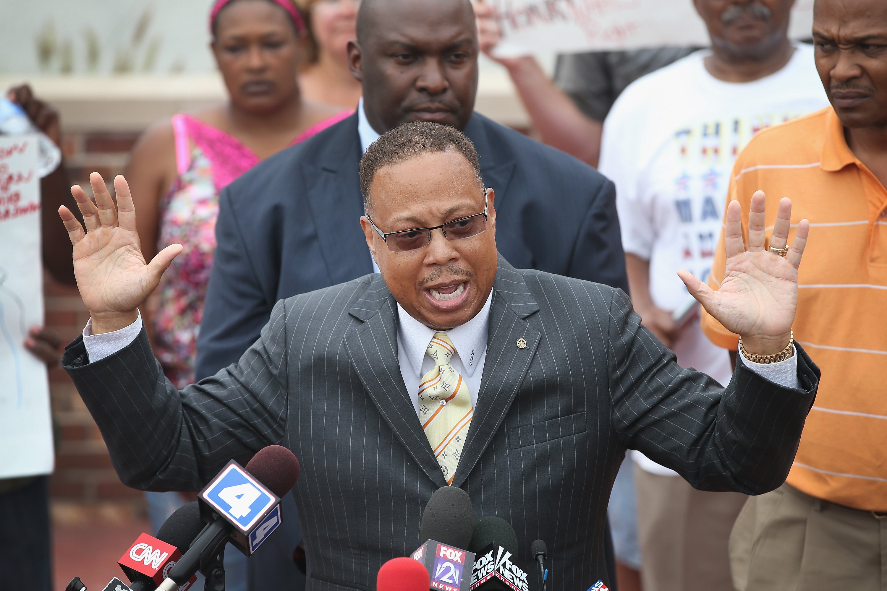 Daryl Parks, an attorney for the family of Michael Brown, addresses the media during a press conference outside the police department on August 15, 2014 in Ferguson, Missouri.
