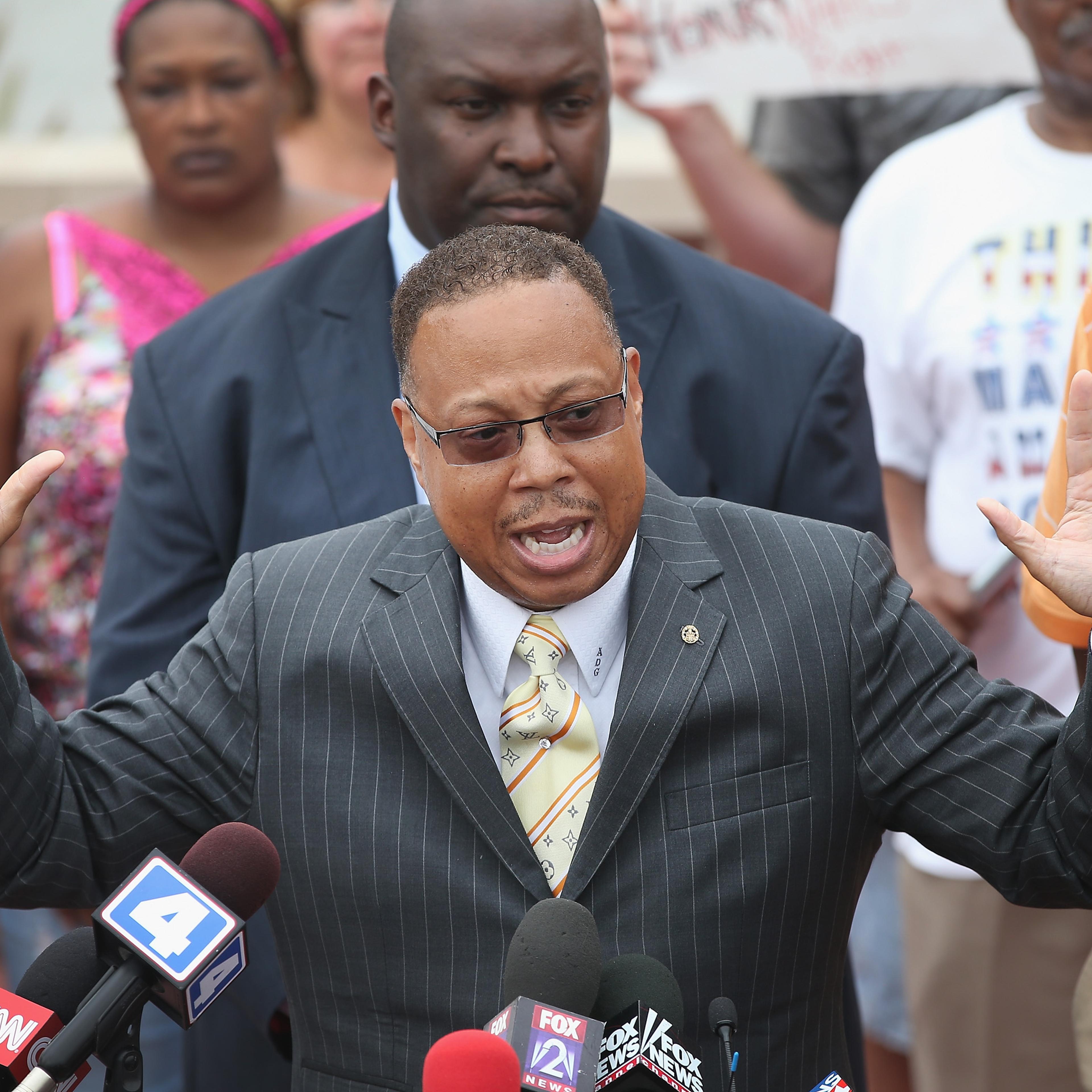 Daryl Parks, an attorney for the family of Michael Brown, addresses the media during a press conference outside the police department on August 15, 2014 in Ferguson, Missouri.