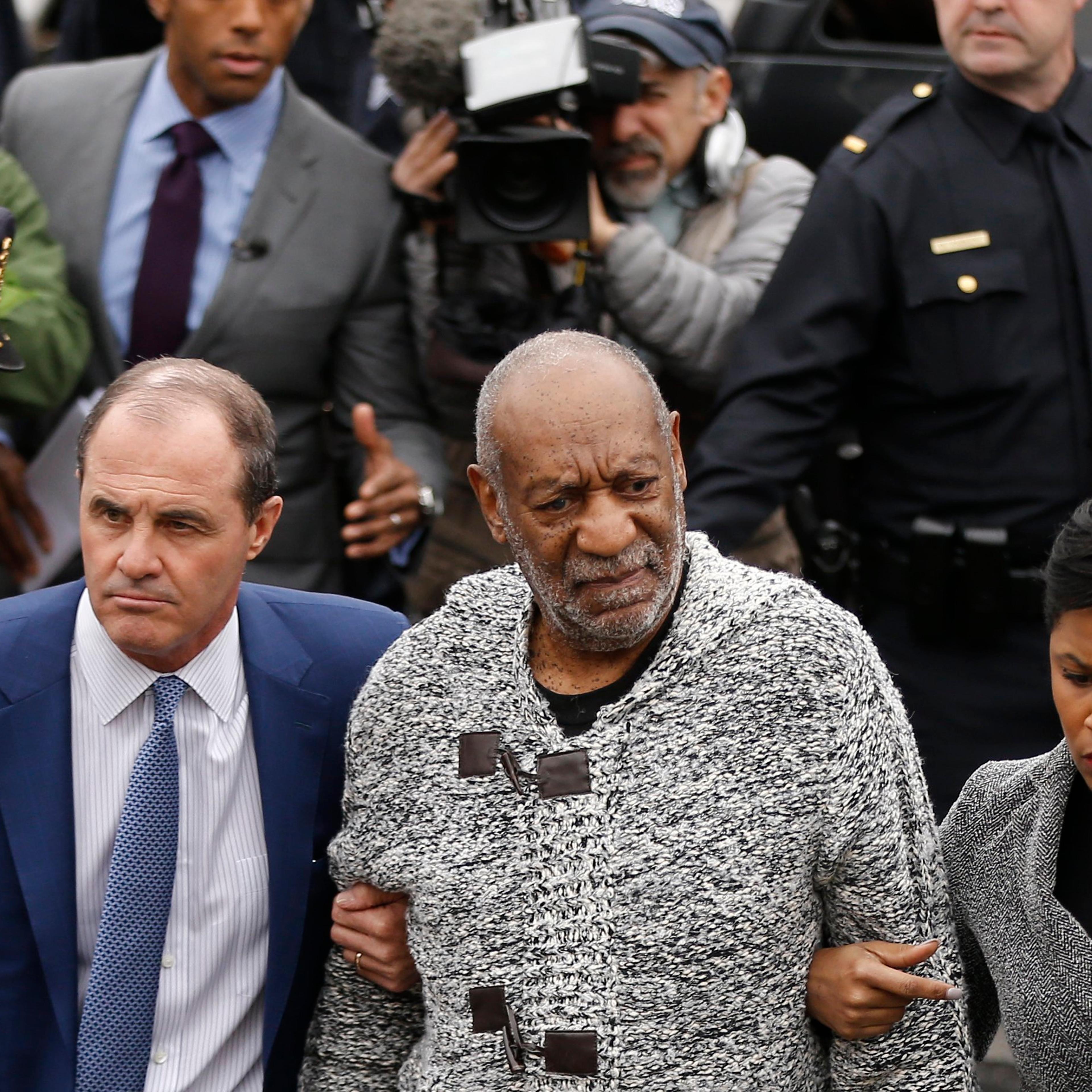 Bill Cosby accompanied by his attorneys Brian McMonagle and Monique Pressley, arrive at court to face a felony charge of aggravated indecent assault, in Elkins Park, Pa. on Dec. 30, 2015.