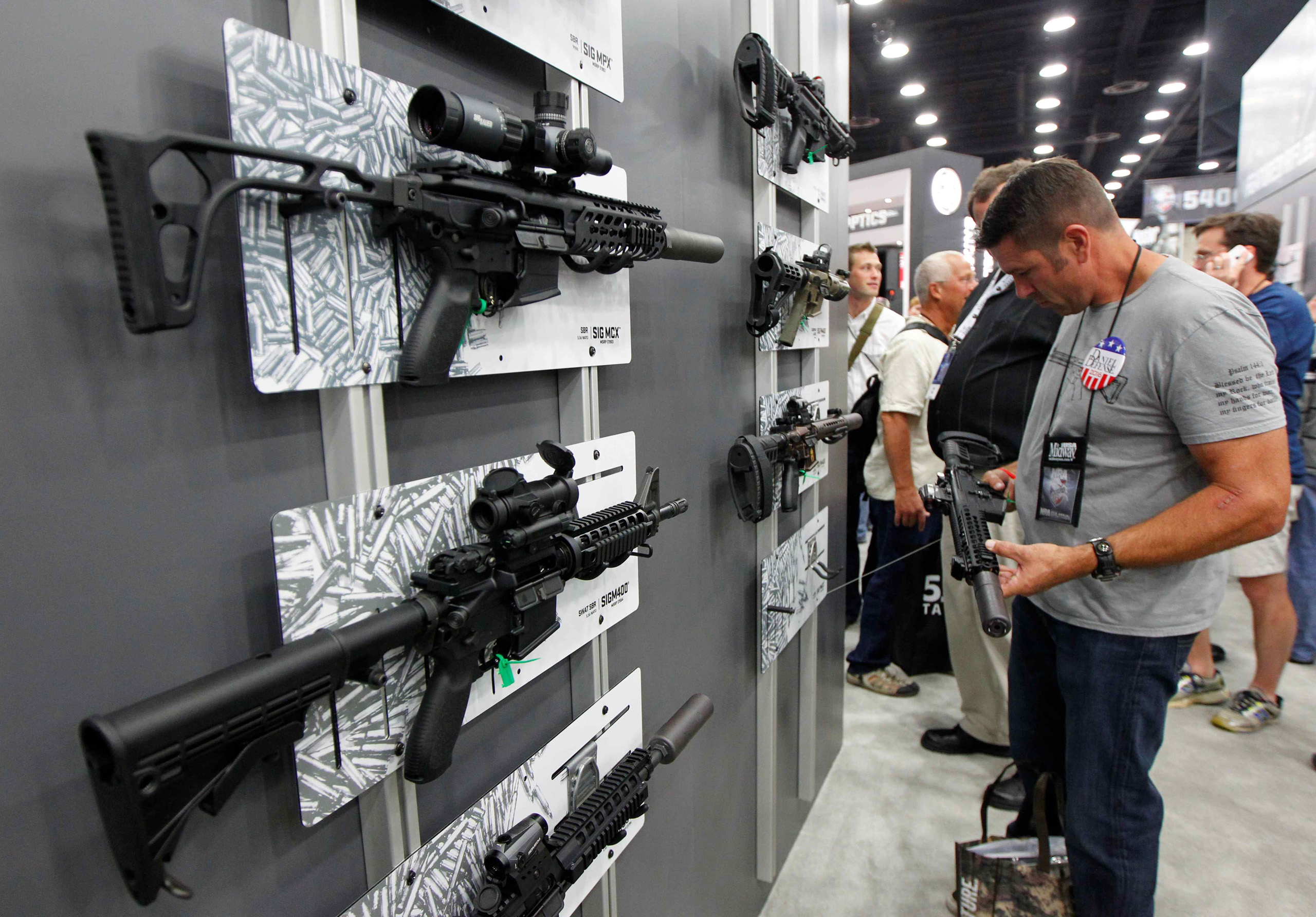 A Sig Sauer MCX rifle can be seen on display at the top left of the photo at the National Rifle Association's annual meetings and exhibits show in Louisville on May 21, 2016.