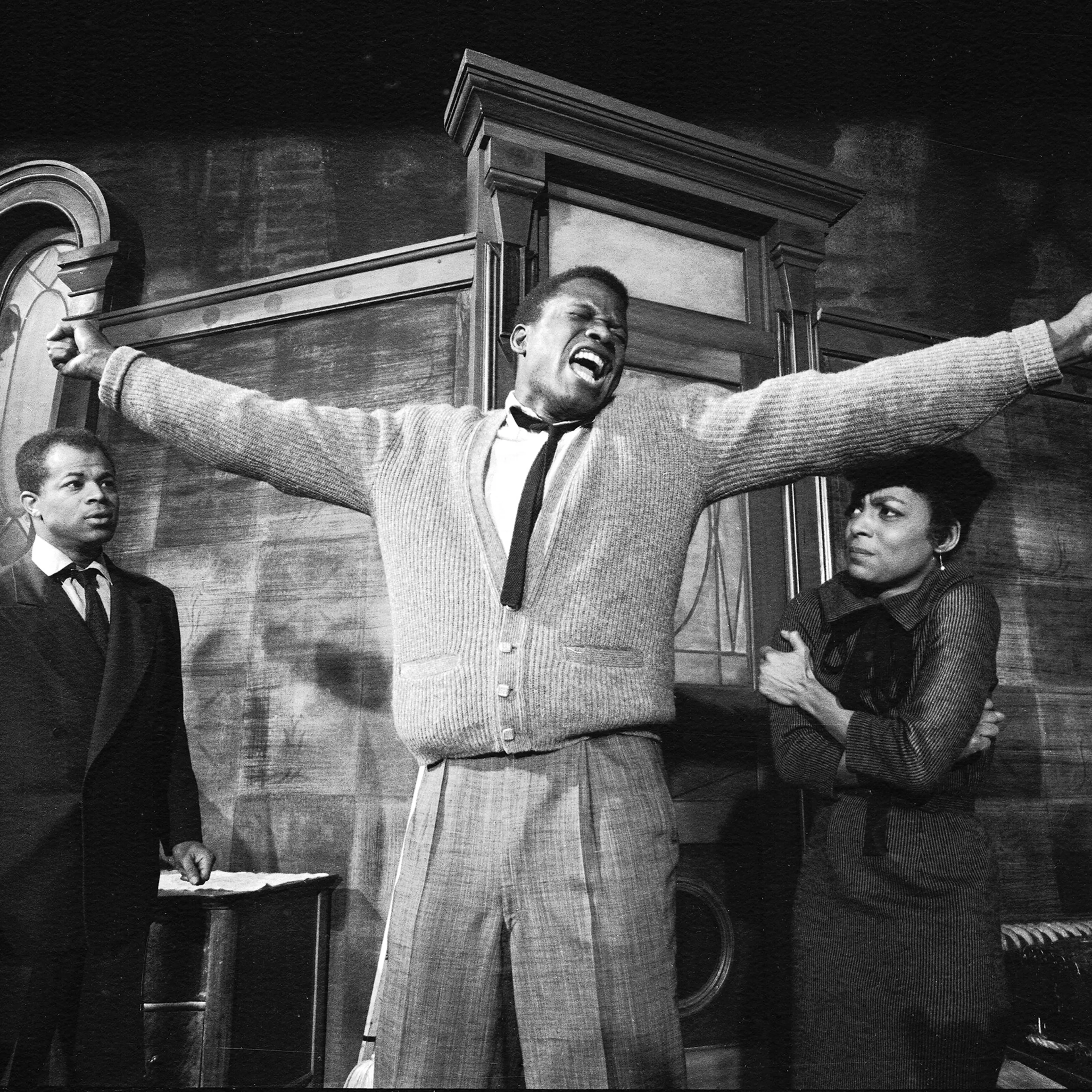 Sidney Poitier in a dramatic scene from play "A Raisin in the Sun", with Ruby Dee, 1959.
