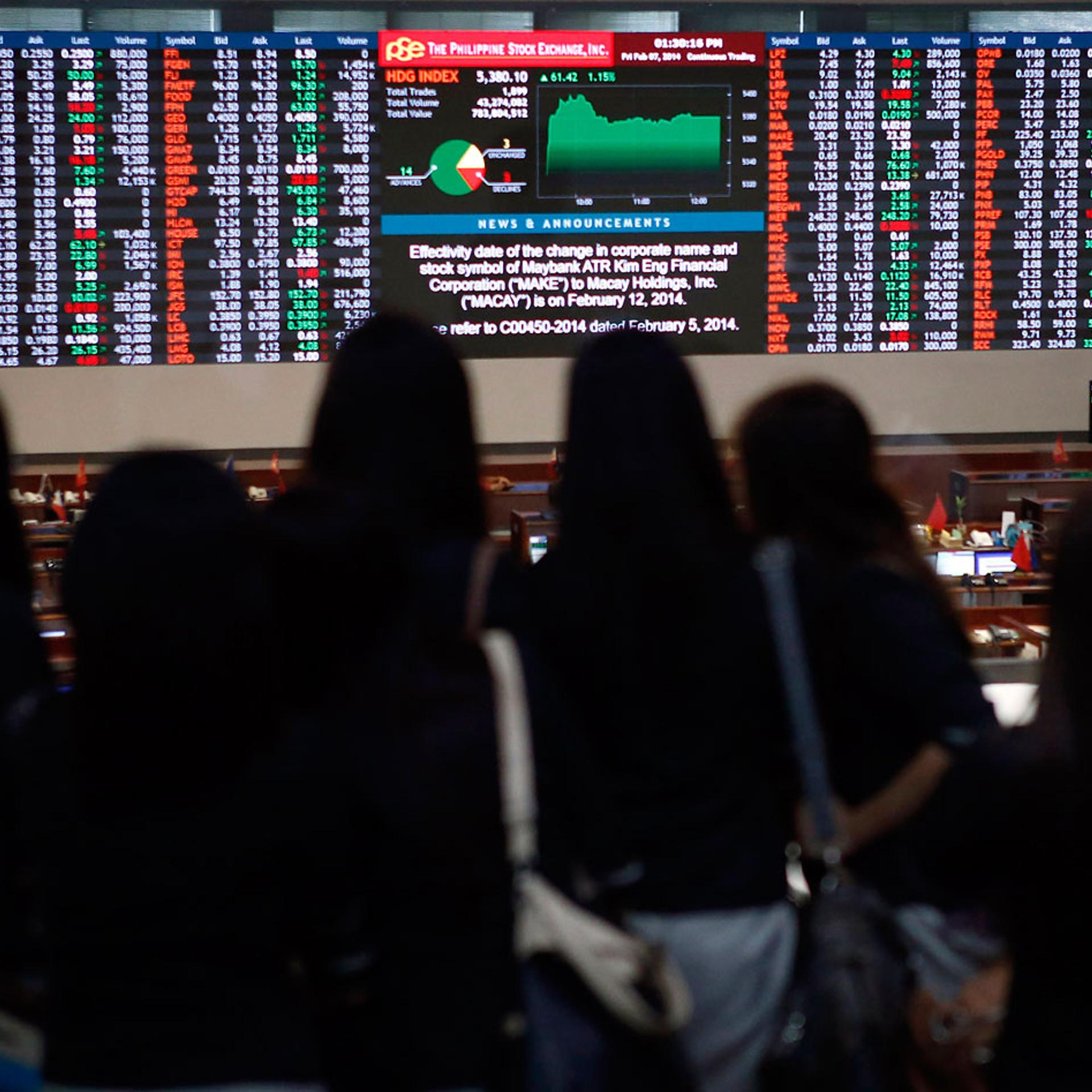 University student interns monitor trading at the Philippine Stock Exchange in Manila's Makati financial district