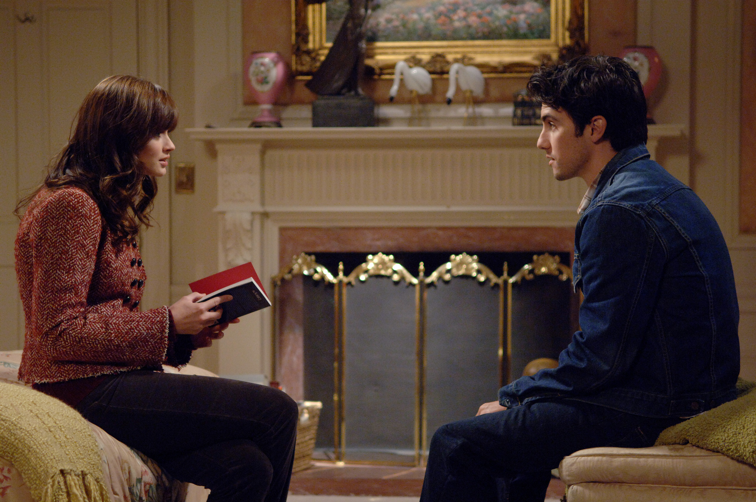 Milo Ventimiglia, who played the role of Jess on Gilmore Girls, sits with Alexis Bledel, who played Rory.
