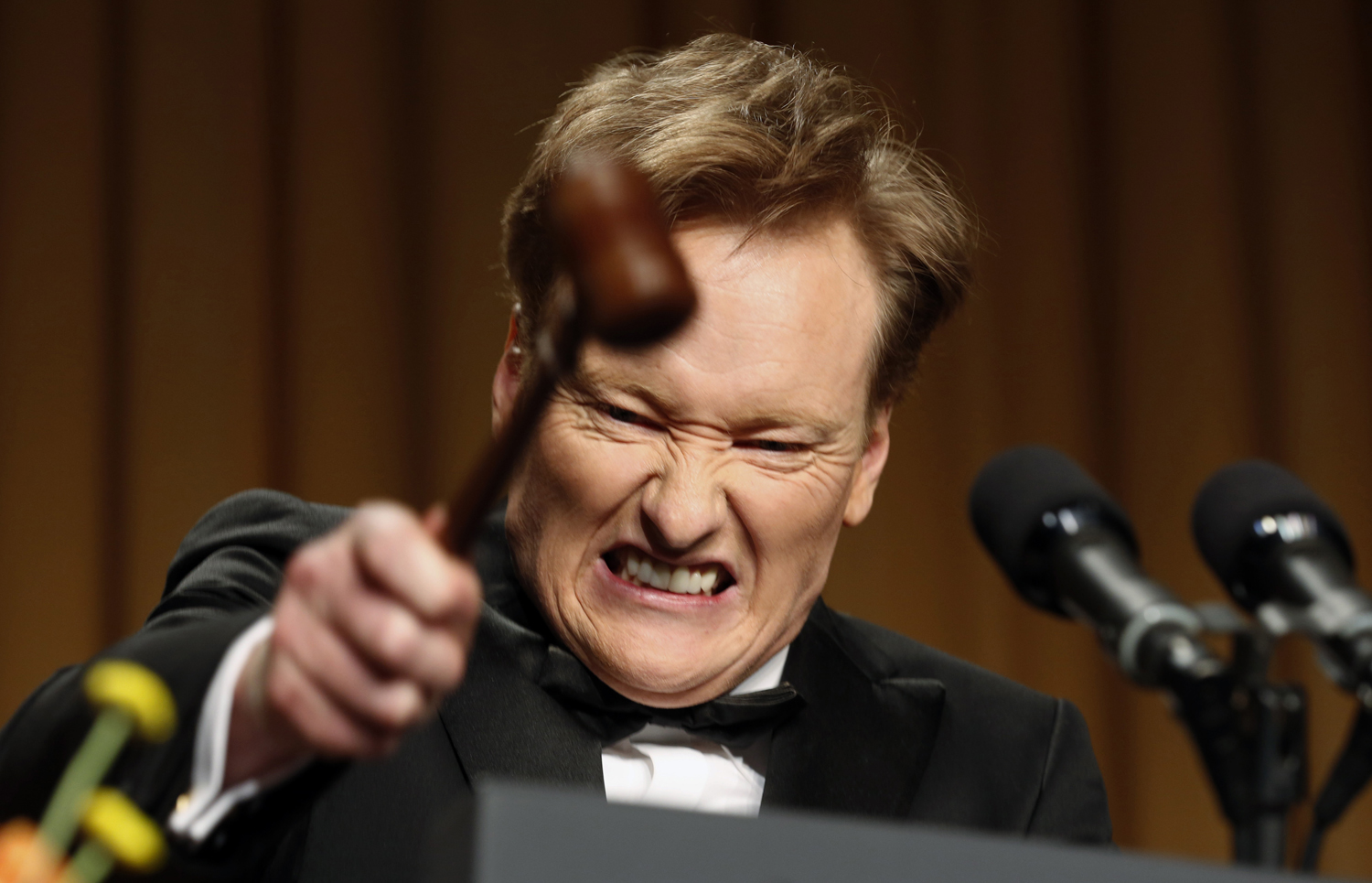 Comedian O'Brien smashes a gavel as he speaks during the White House Correspondents Association Dinner in Washington