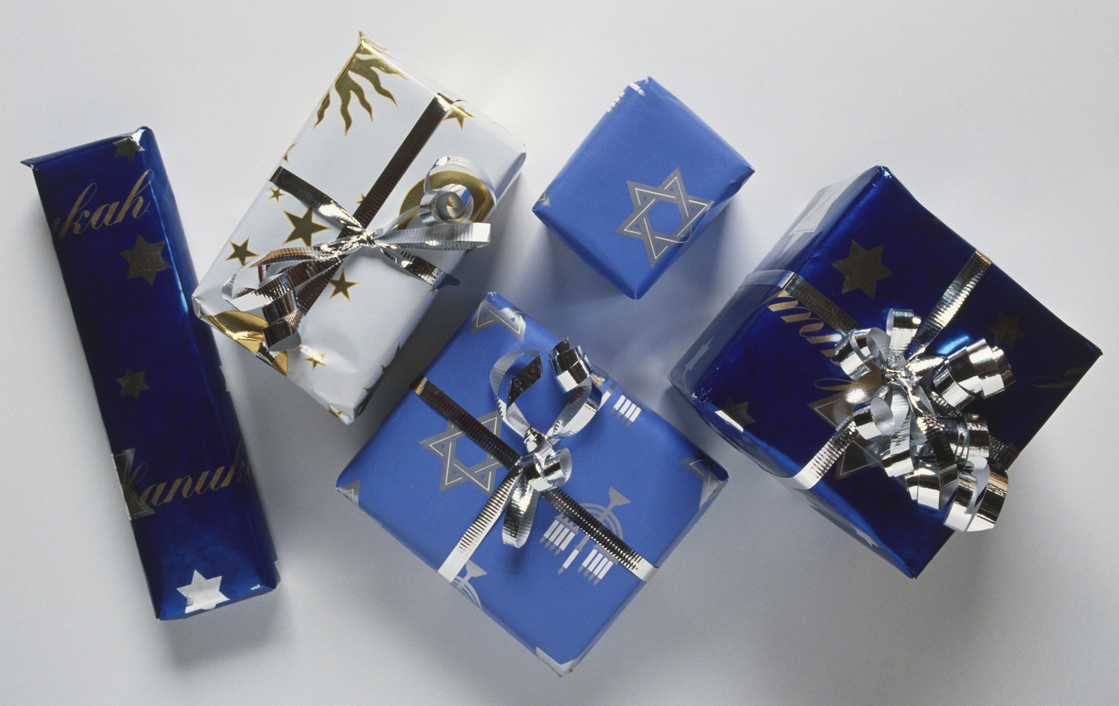 Presents for Hanukkah, wrapped in blue paper and silver bows.