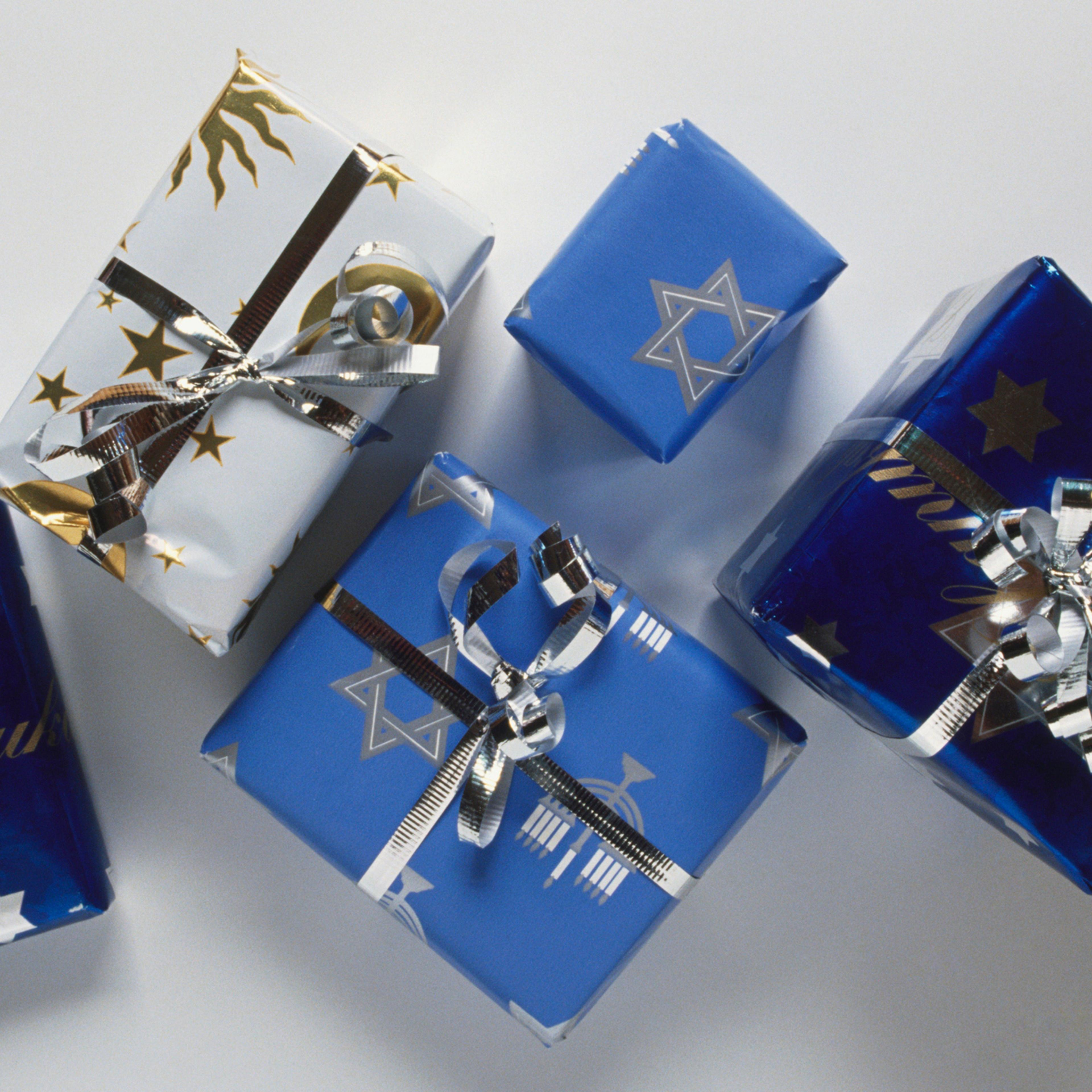 Presents for Hanukkah, wrapped in blue paper and silver bows.