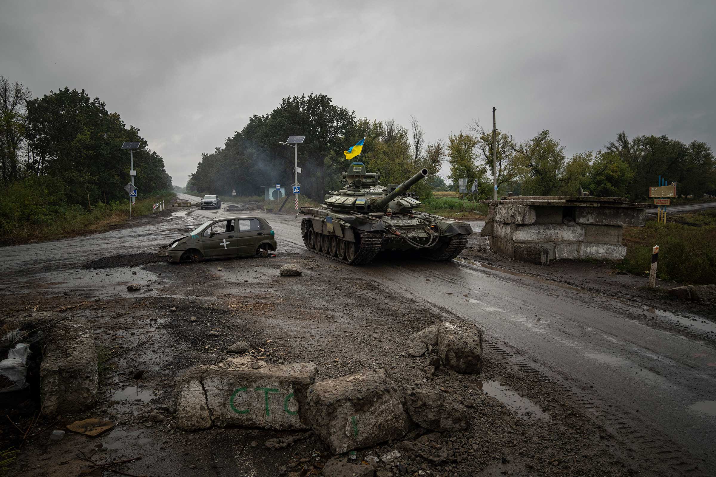 A Ukrainian tank passes a former Russian checkpoint on Sept. 16 in the retaken city of Izyum.