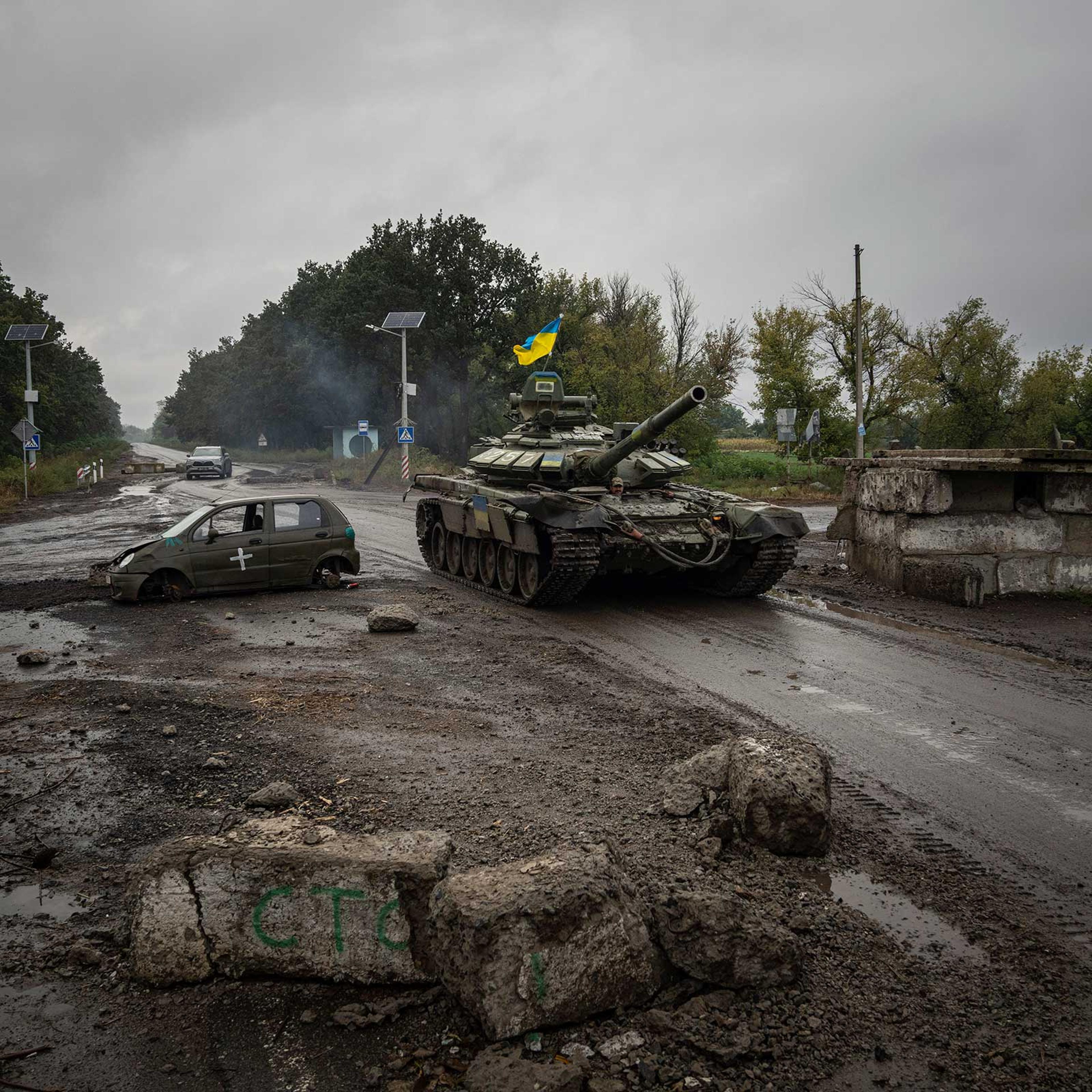 A Ukrainian tank passes a former Russian checkpoint on Sept. 16 in the retaken city of Izyum.