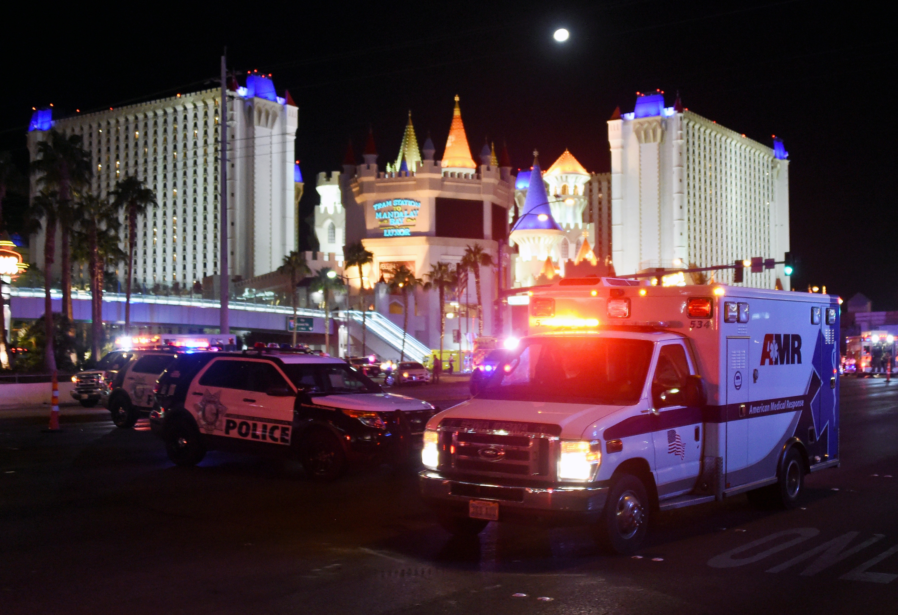 An ambulance leaves the intersection of Las Vegas Boulevard and Tropicana Ave. after a mass shooting at a country music festival nearby on October 2, 2017 in Las Vegas, Nevada.