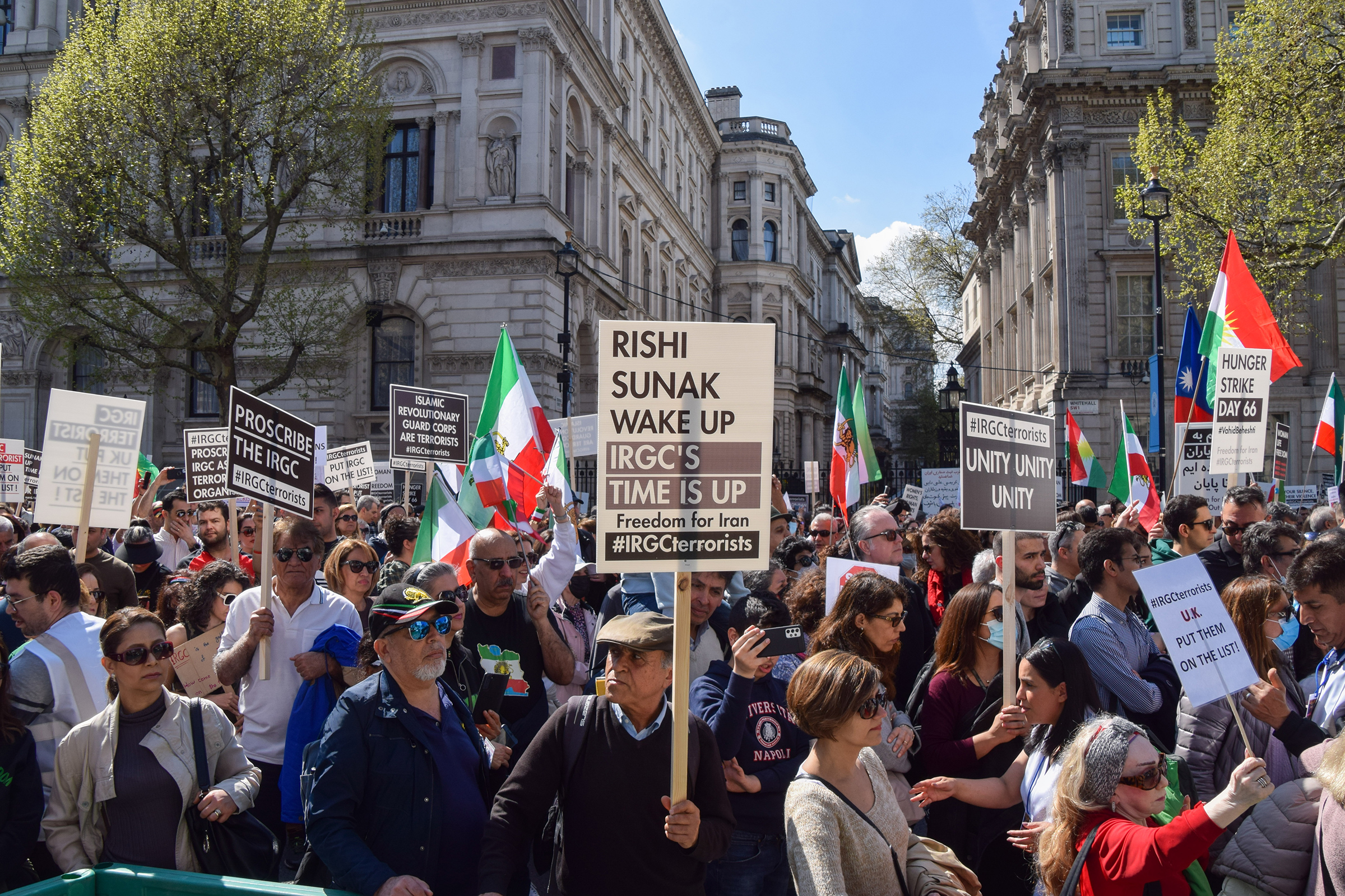 A protester holds a "Rishi Sunak wake up" placard during the demonstration outside Downing Street in London on April 29. Thousands of protesters marched to Downing Street demanding that the UK Government proscribes the Islamic Revolutionary Guard Corps (IRGC) in Iran as a terrorist organisation. 