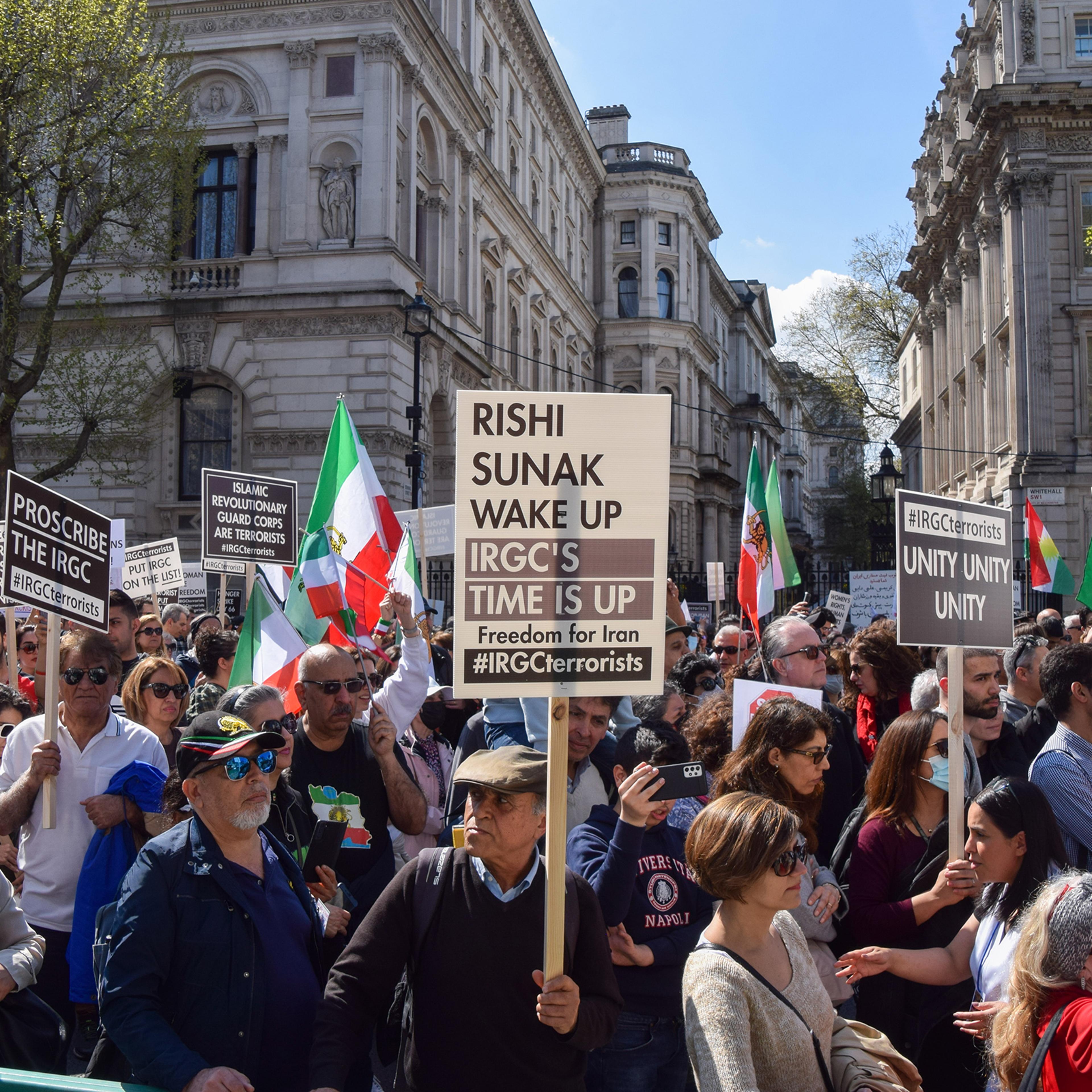 A protester holds a "Rishi Sunak wake up" placard during the demonstration outside Downing Street in London on April 29. Thousands of protesters marched to Downing Street demanding that the UK Government proscribes the Islamic Revolutionary Guard Corps (IRGC) in Iran as a terrorist organisation.