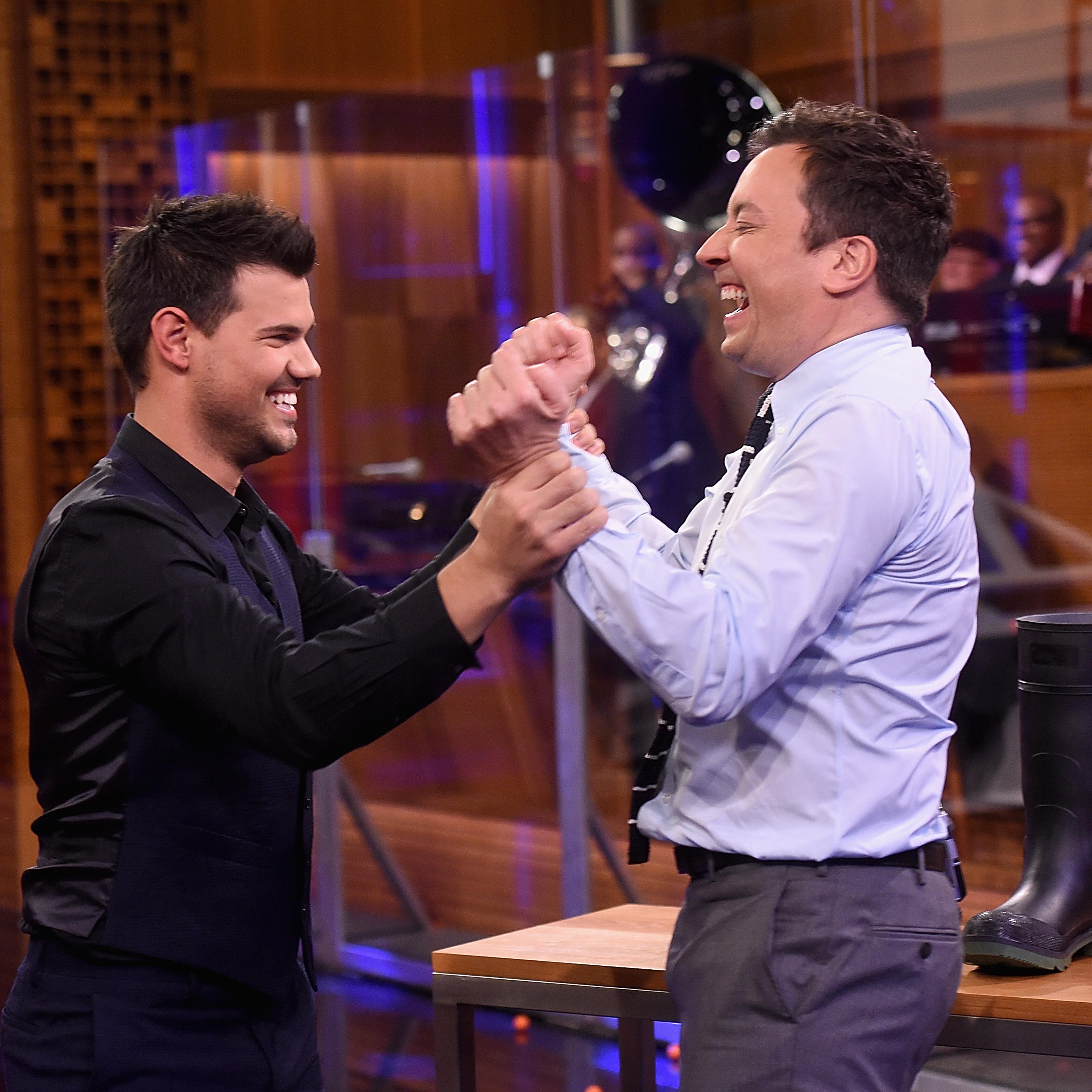 Taylor Lautner and host Jimmy Fallon during a segment on "The Tonight Show Starring Jimmy Fallon" at NBC Studios on March 31, 2016 in New York City.