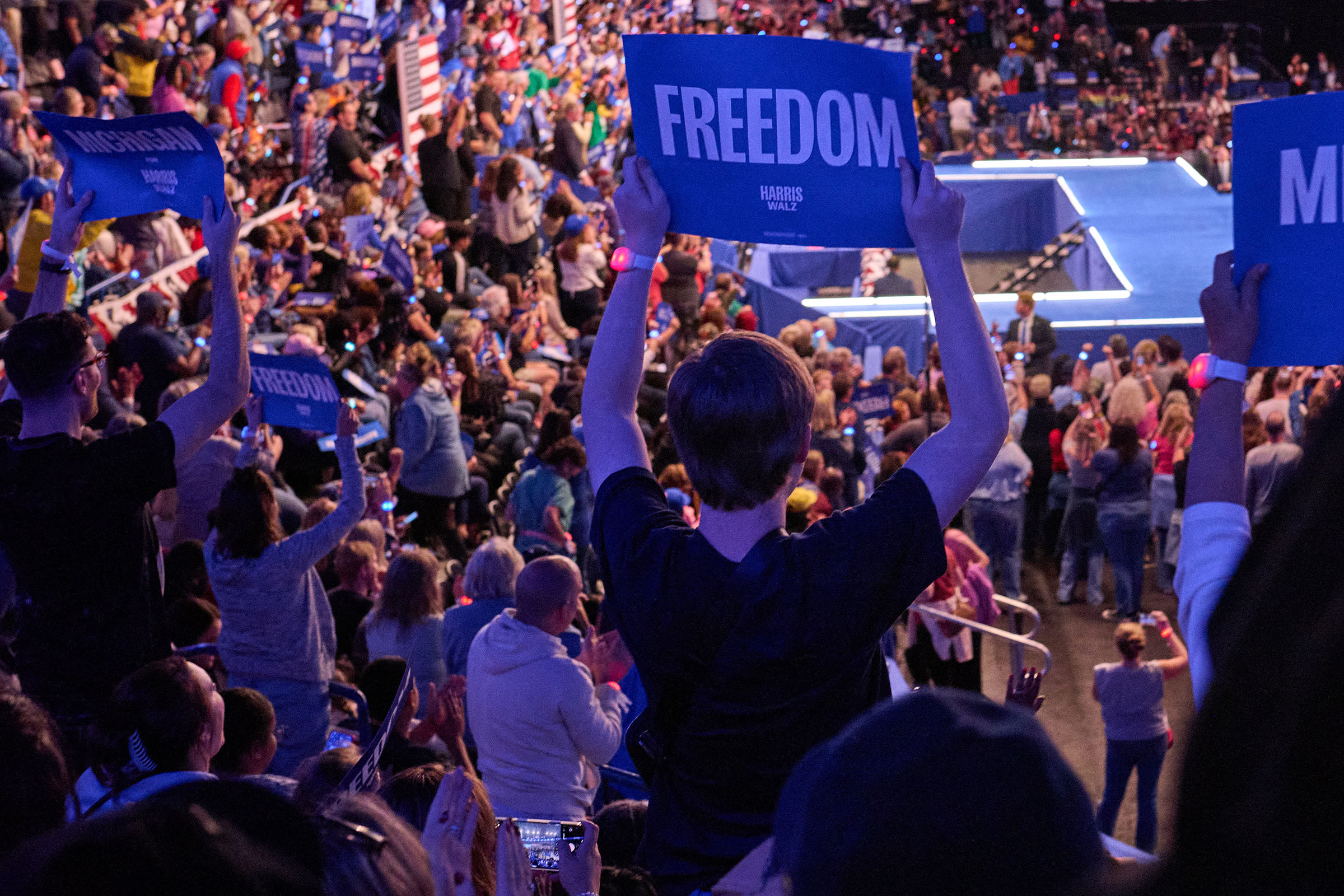 Supporters watch Vice President Kamala Harris speak during a rally in Flint, Michigan on Oct. 4, 2024. 