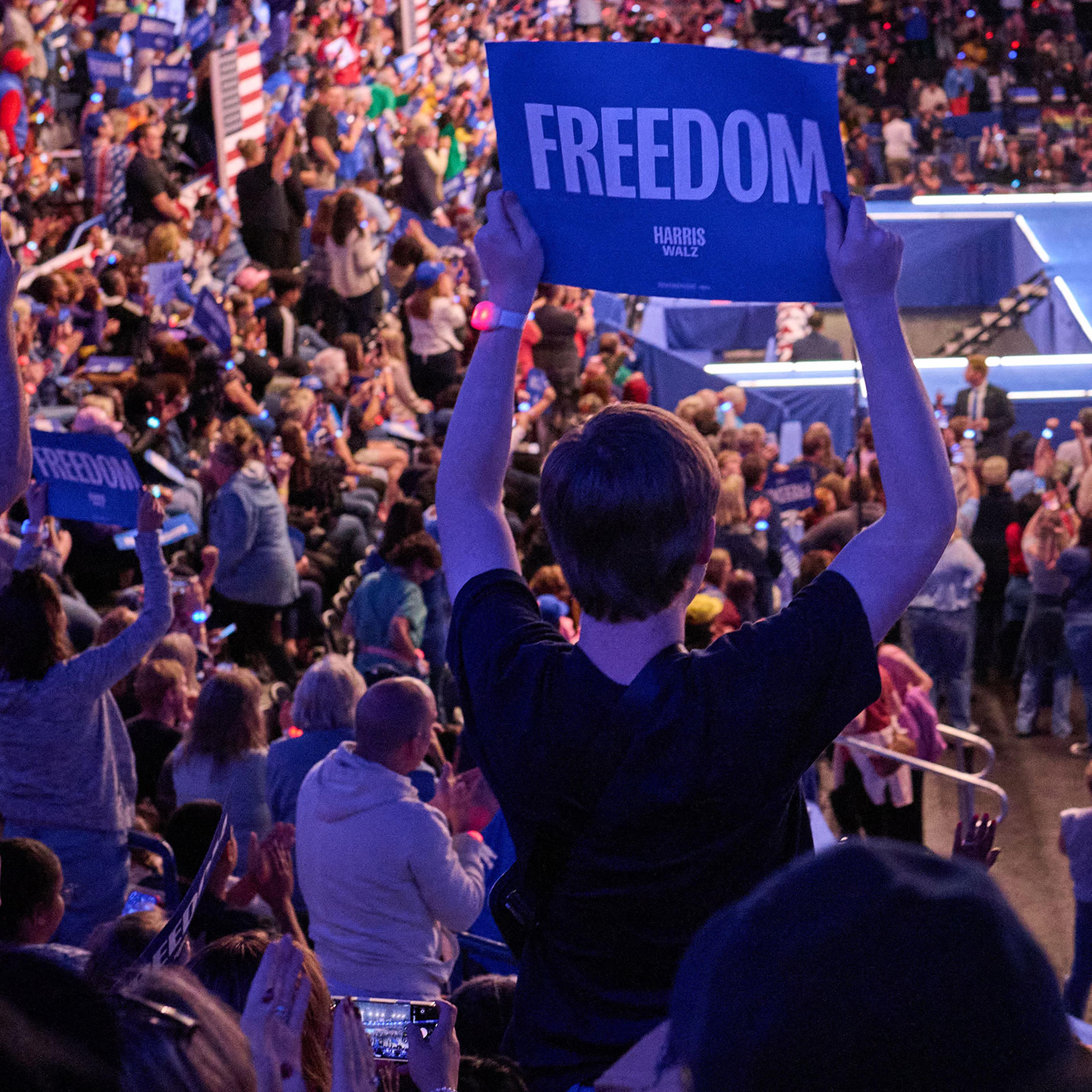 Supporters watch Vice President Kamala Harris speak during a rally in Flint, Michigan on Oct. 4, 2024.