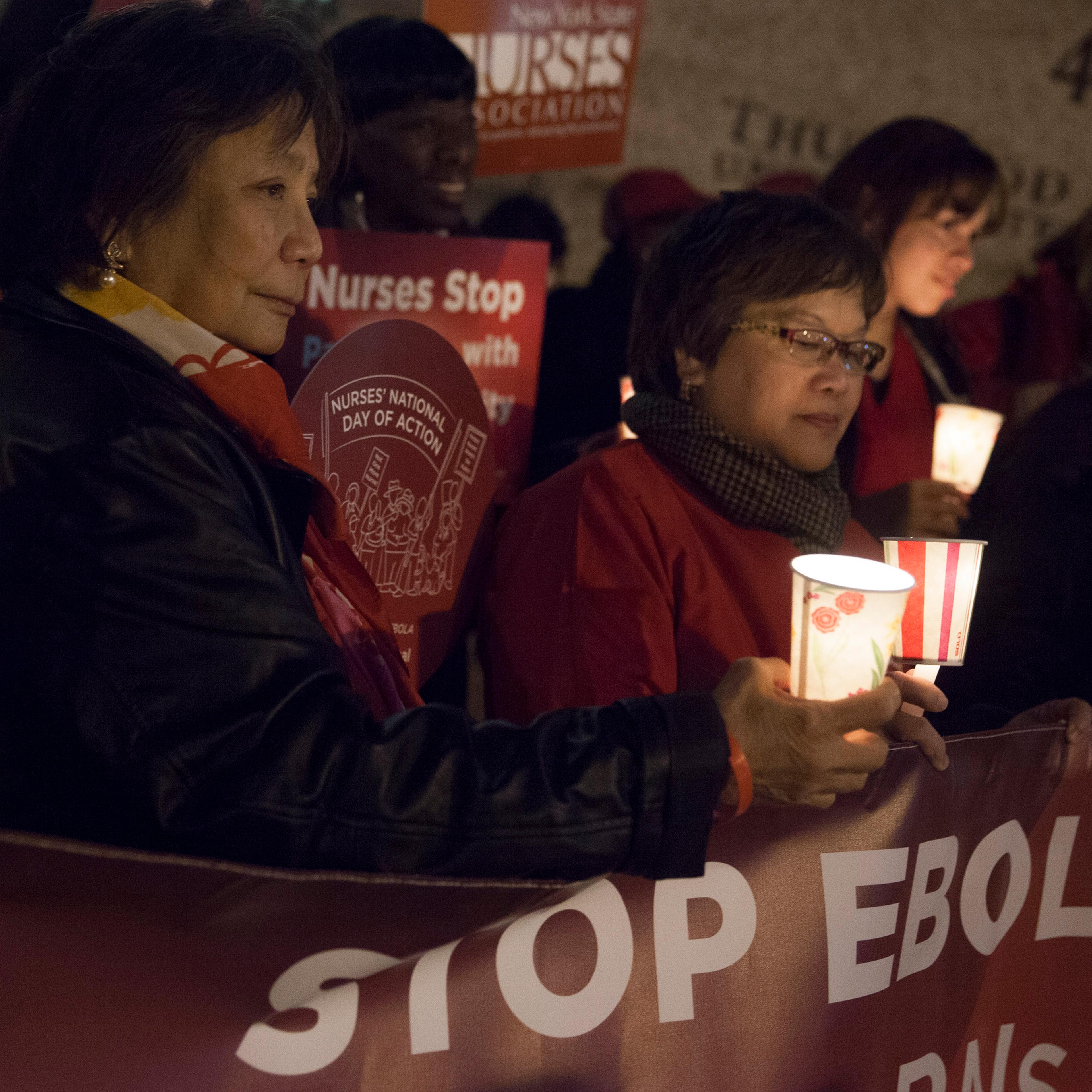 Nurses from the New York State Nurses Association protest for improved Ebola safeguards, part of a national day of action, in New York