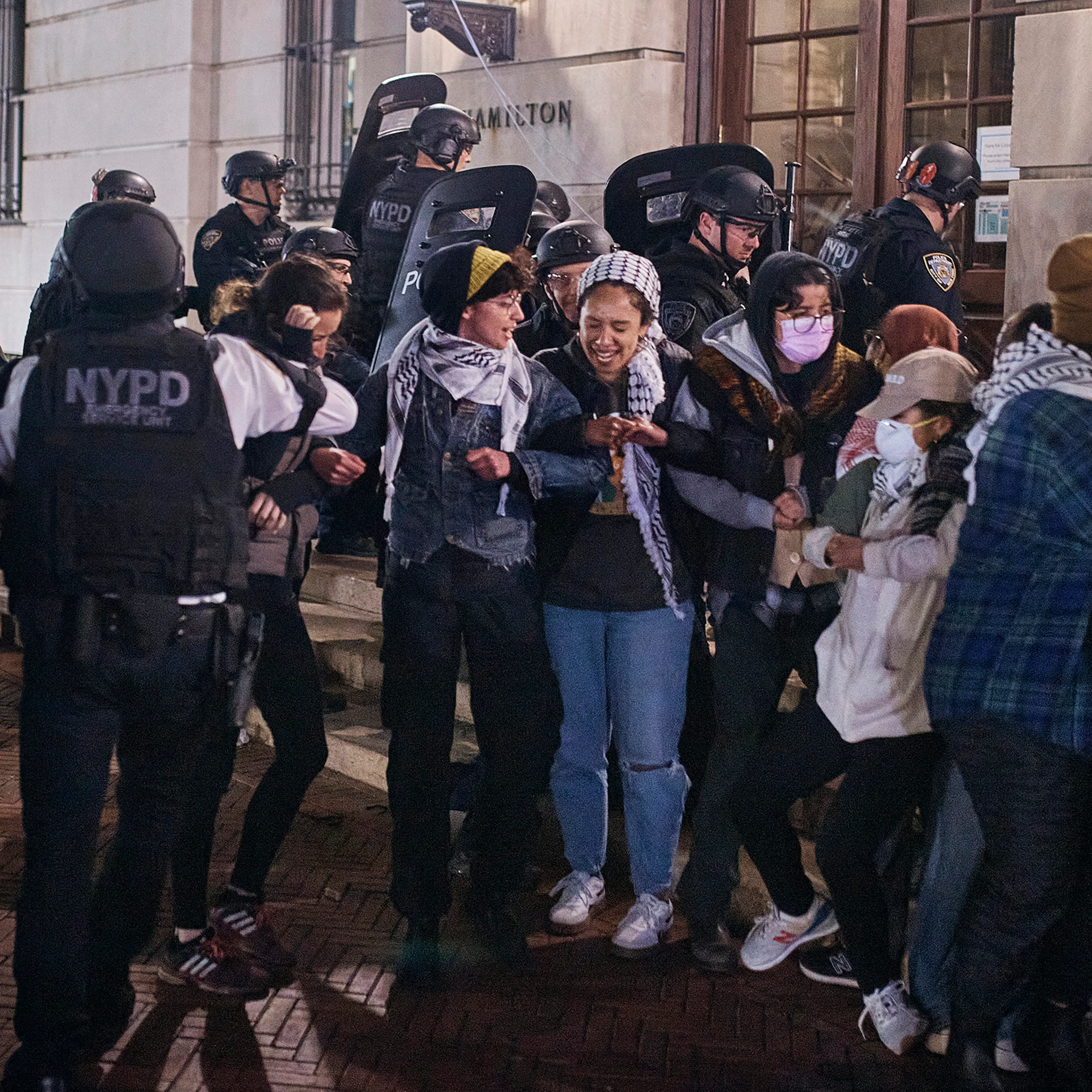 Police remove protestors blocking the entrance to Hamilton Hall, occupied by pro-Palestinian student protestors, on Columbia University campus in New York City, on April 30, 2024.