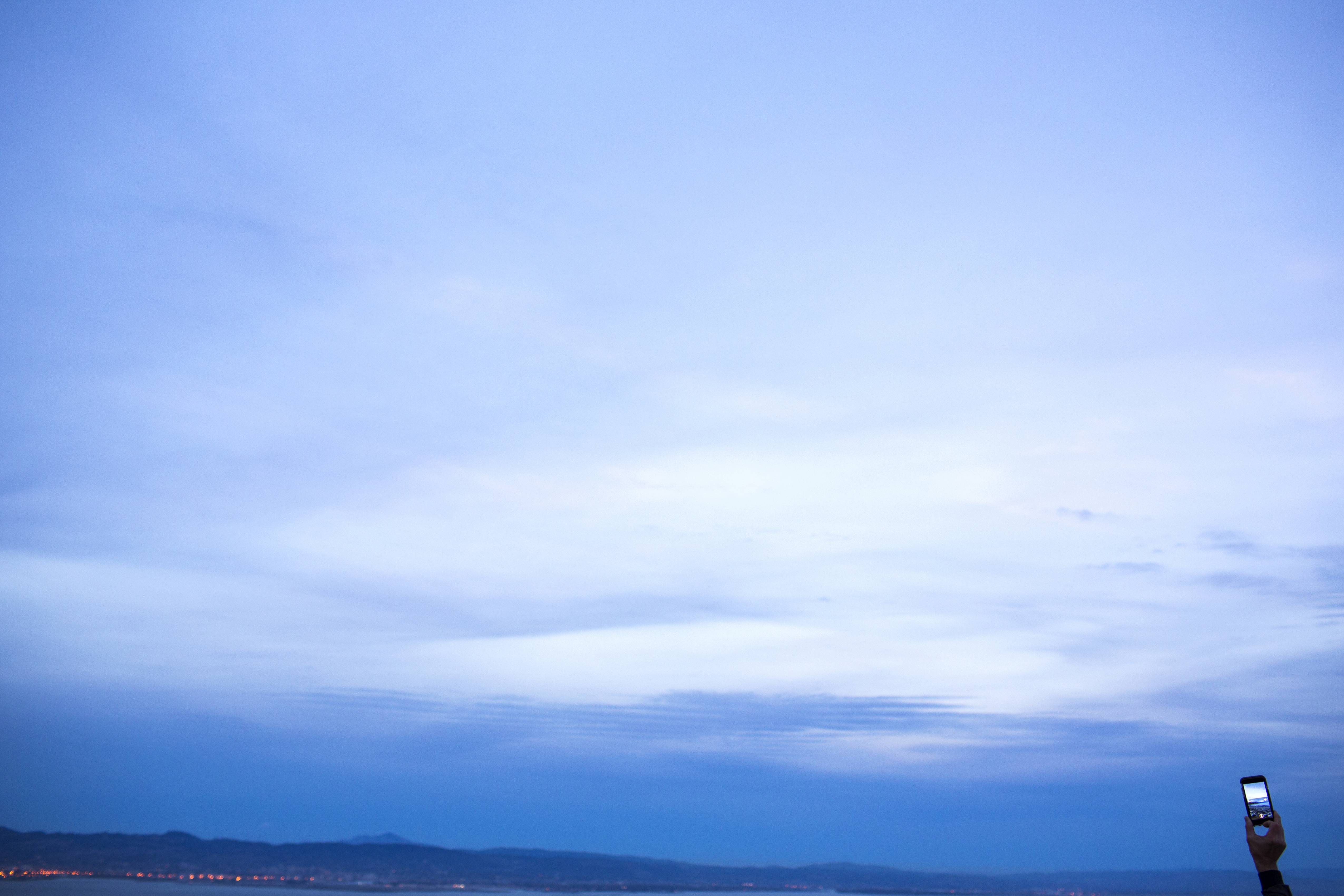 A man fell to his death off a San Diego cliff while he was distracted by an electronic device