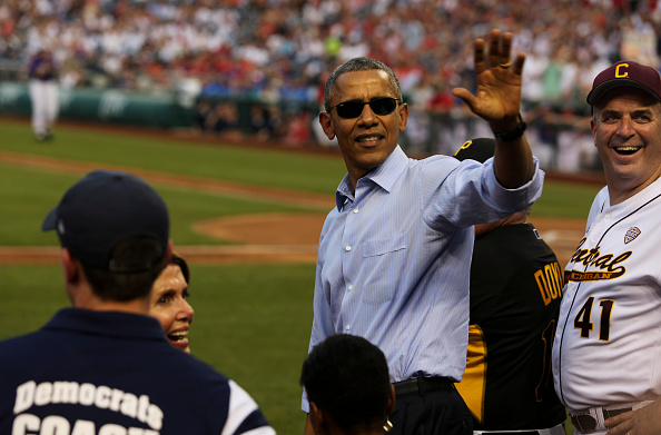 President Barack Obama waves at the crowd during the 2015 Congressional Baseball Game at the National Parks Stadium, on June 11, 2015 in Washington D.C.
