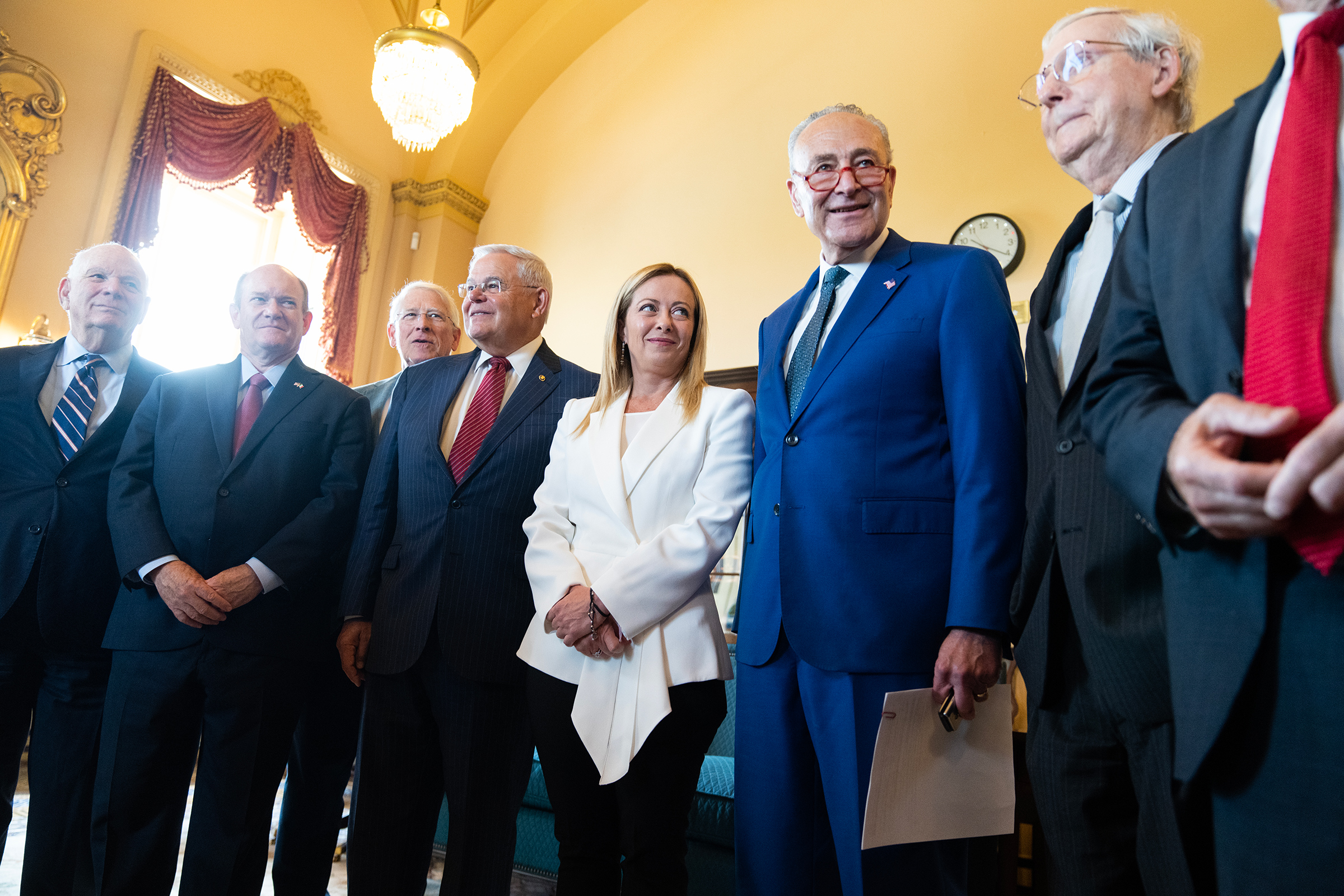 Italian Prime Minister Giorgia Meloni poses with senators before a bipartisan meeting in the U.S. Capitol on July 27. From left are, Sens. Ben Cardin, D-Md., Chris Coons, D-Del., Roger Wicker, R-Miss., Bob Menendez, D-N.J., Meloni, Senate Majority Leader Charles Schumer, D-N.Y., and Senate Minority Leader Mitch McConnell, R-Ky. 