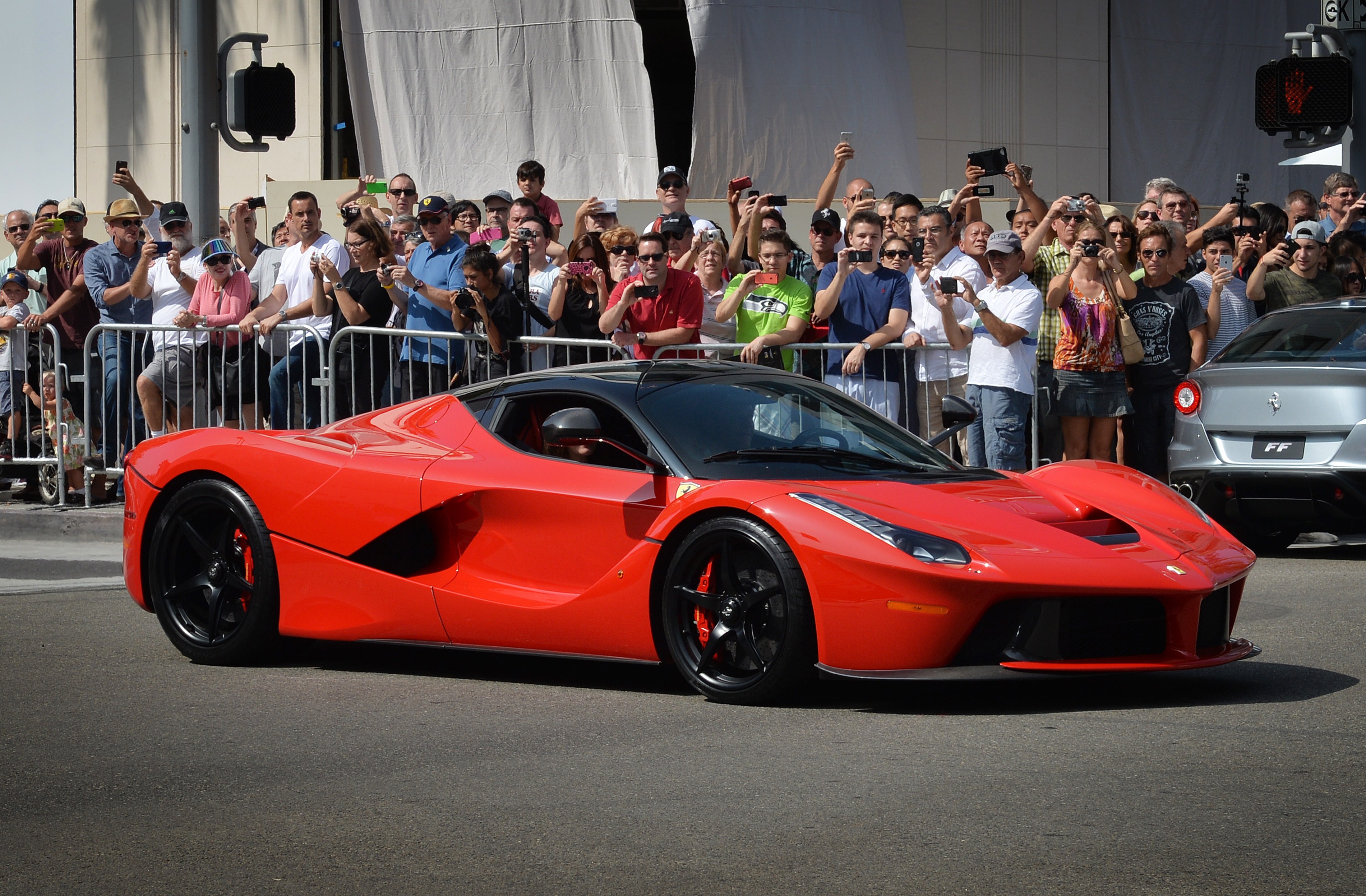 A Ferrari arrives to join the hundreds of Ferrari's on display at the "Race Through the Decades 1954-2014" to celebrate its 60th anniversary of Ferrari in the United States at Beverly Hills on October 12, 2014.