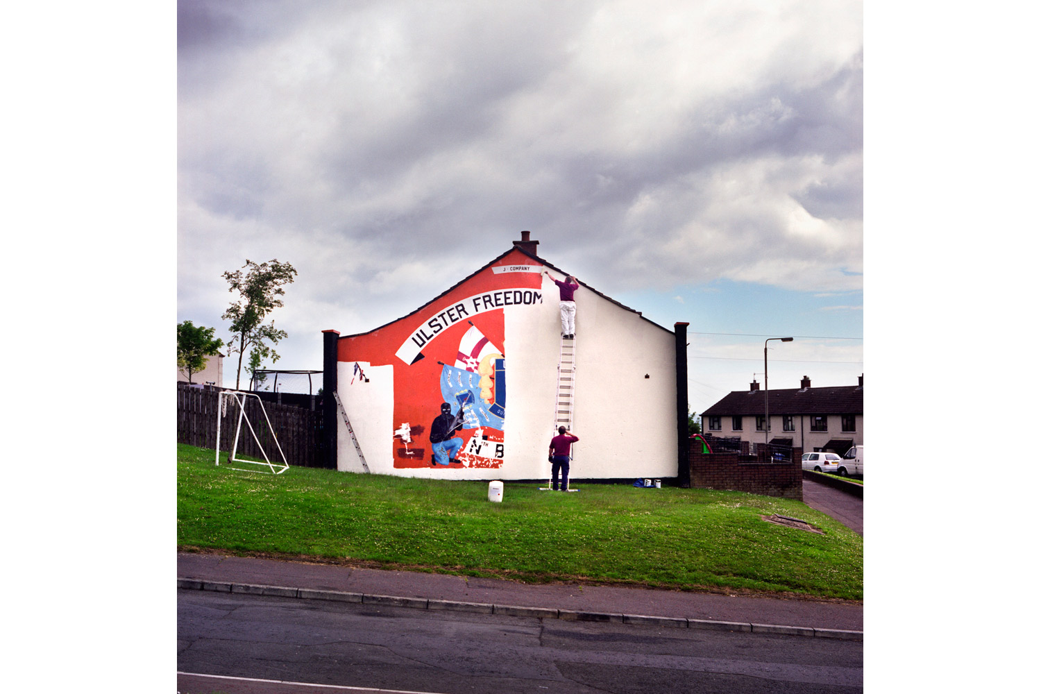 <i>Photographs from the project </i>Men and My Daddy</br></br>
The removal of the last loyalist UDA (Ulster Defense Association) paramilitary mural in North Belfast. As part of a larger revitalization effort, the UDA has committed to replacing traditional murals with more peaceful ones. 2010.