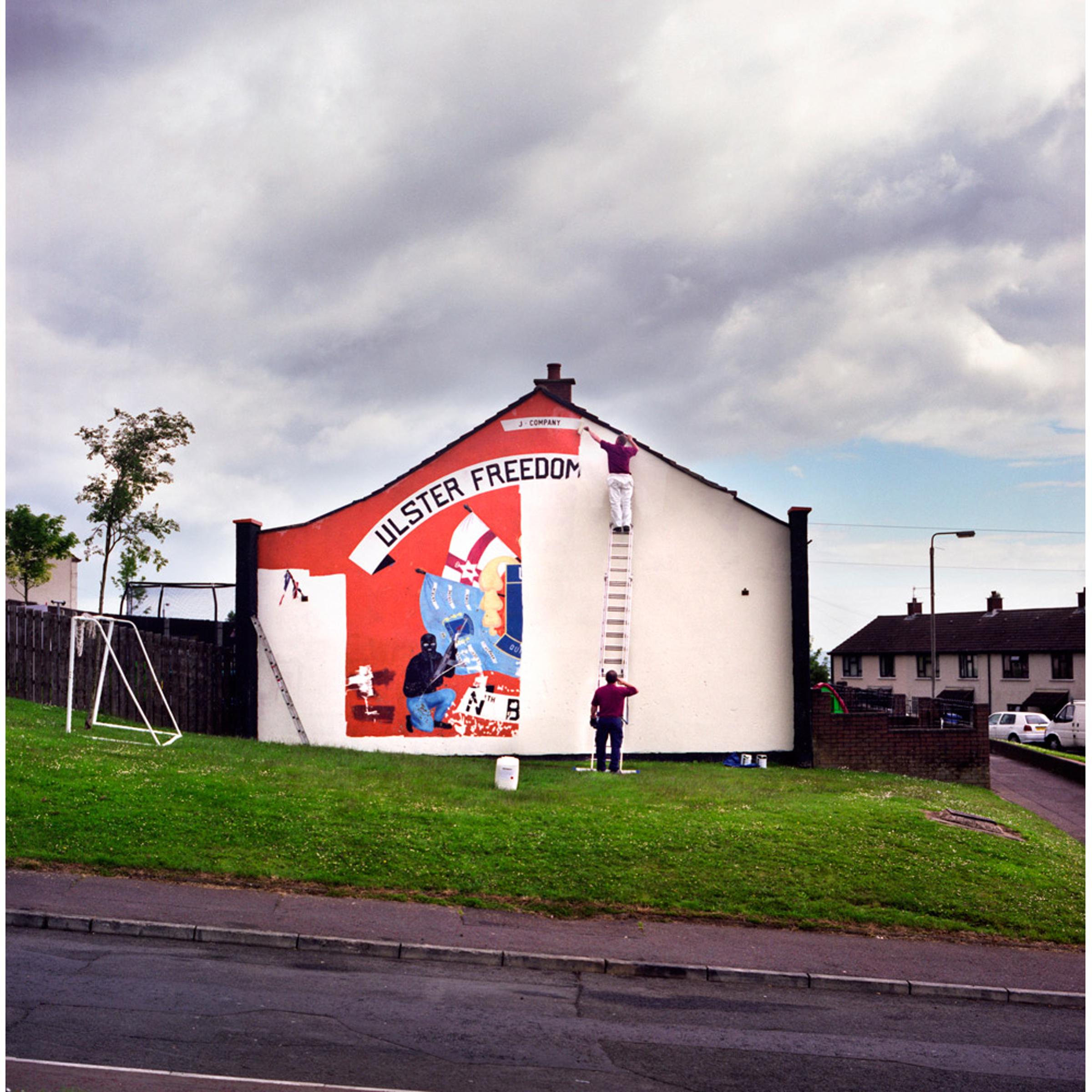 <i>Photographs from the project </i>Men and My Daddy</br></br>
The removal of the last loyalist UDA (Ulster Defense Association) paramilitary mural in North Belfast. As part of a larger revitalization effort, the UDA has committed to replacing traditional murals with more peaceful ones. 2010.