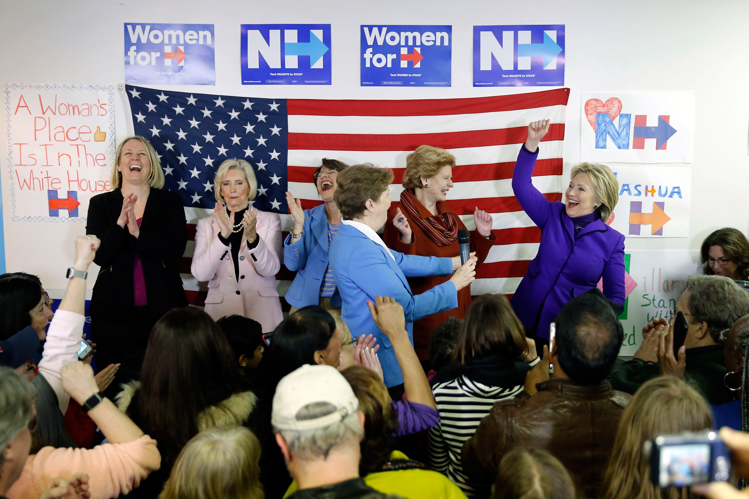 Democratic presidential candidate Hillary Clinton, right, is joined on staged EMILY's List President Stephanie Schriock, left, Lily Ledbetter, Sen. Amy Klobuchar, D-Minn., Jeanne Shaheen, D-N.H., and Sen. Debbie Stabenow, D-Mich., during a visit to a cam
