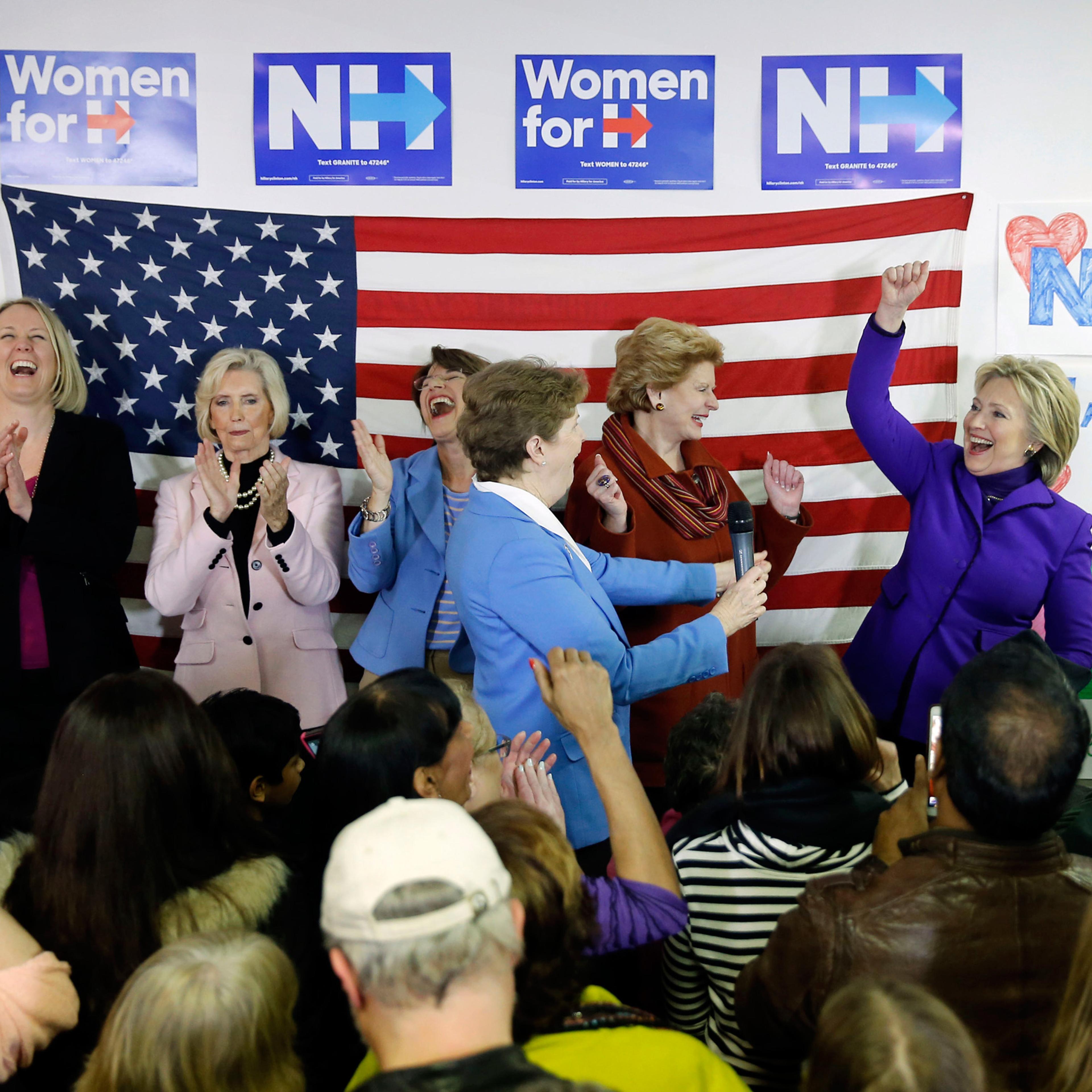 Democratic presidential candidate Hillary Clinton, right, is joined on staged EMILY's List President Stephanie Schriock, left, Lily Ledbetter, Sen. Amy Klobuchar, D-Minn., Jeanne Shaheen, D-N.H., and Sen. Debbie Stabenow, D-Mich., during a visit to a cam