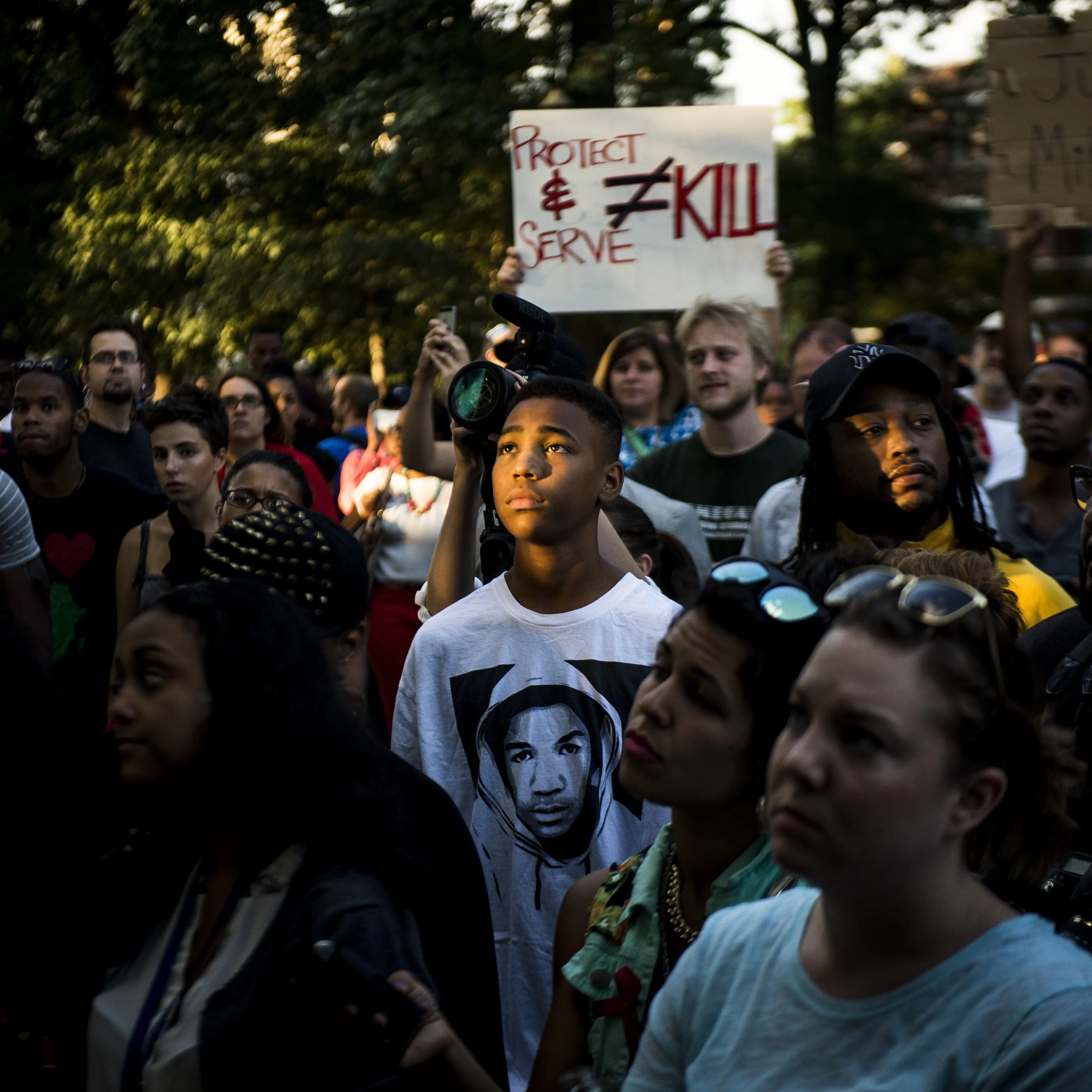 A demonstrator wearing a Trayvon Martin T-shirt stands with others in Washington D.C. to express solidarity with protesters in Ferguson, Mo.