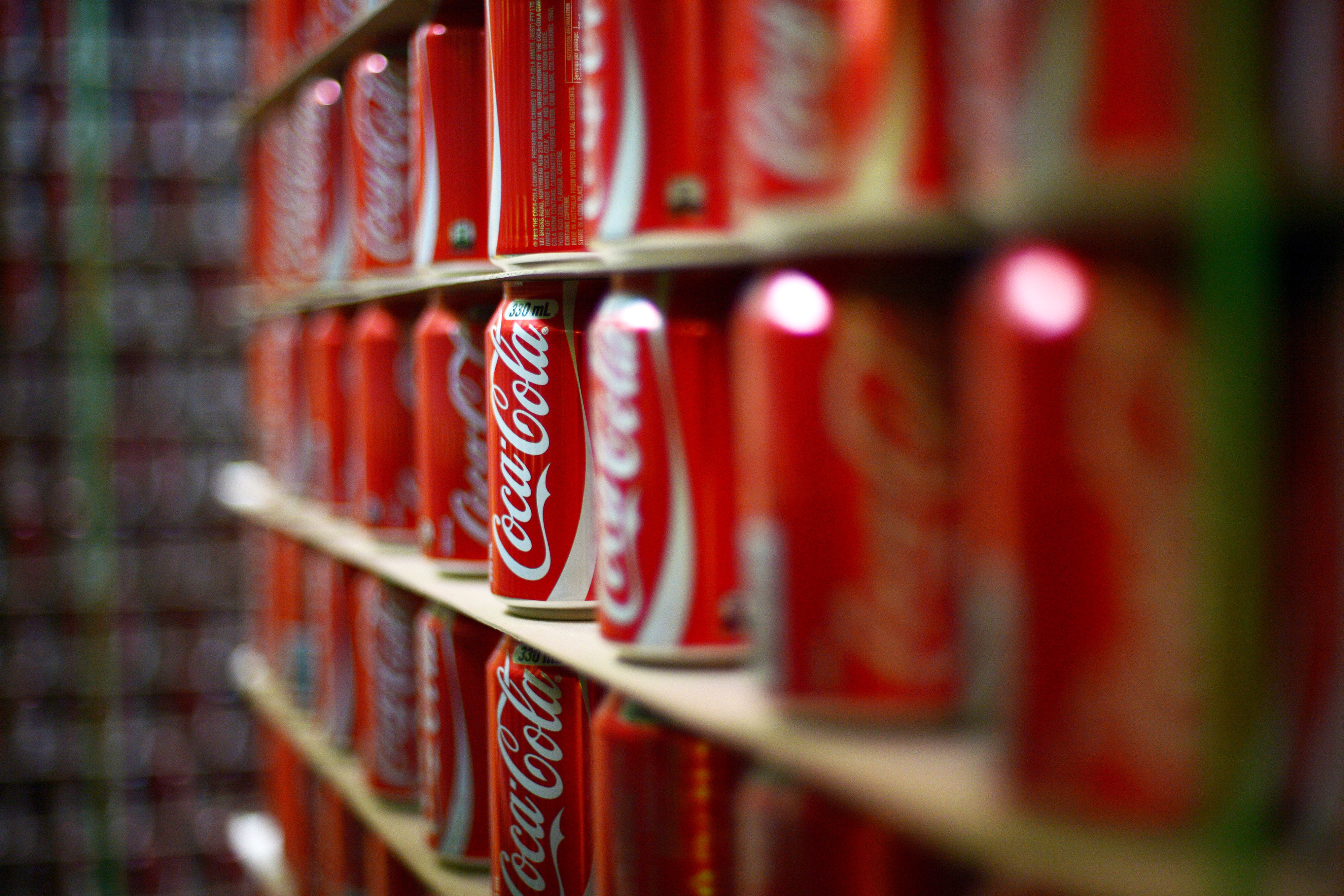 Coca-Cola cans are stacked at a production facility in Melbourne, Australia on Feb. 16, 2016.