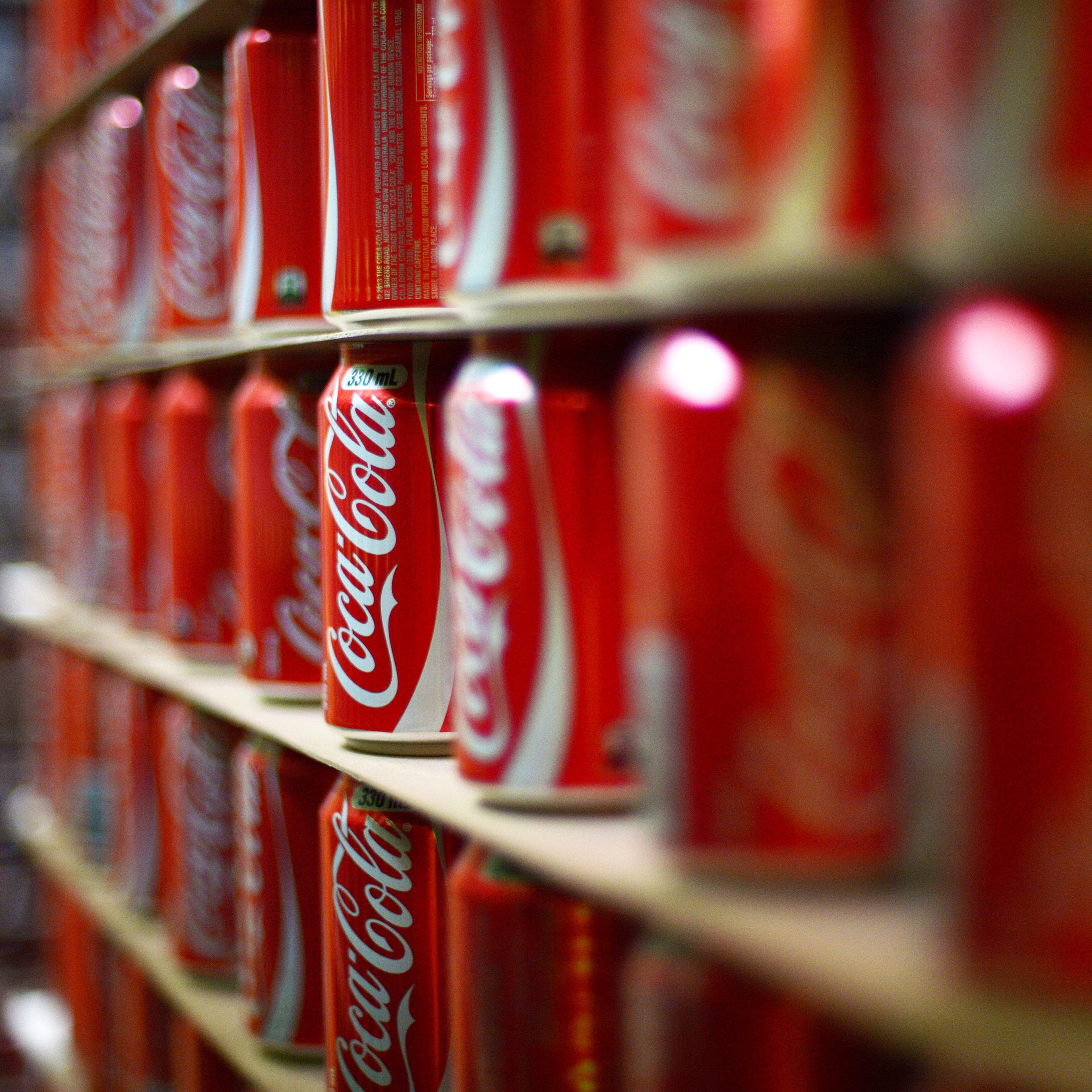 Coca-Cola cans are stacked at a production facility in Melbourne, Australia on Feb. 16, 2016.
