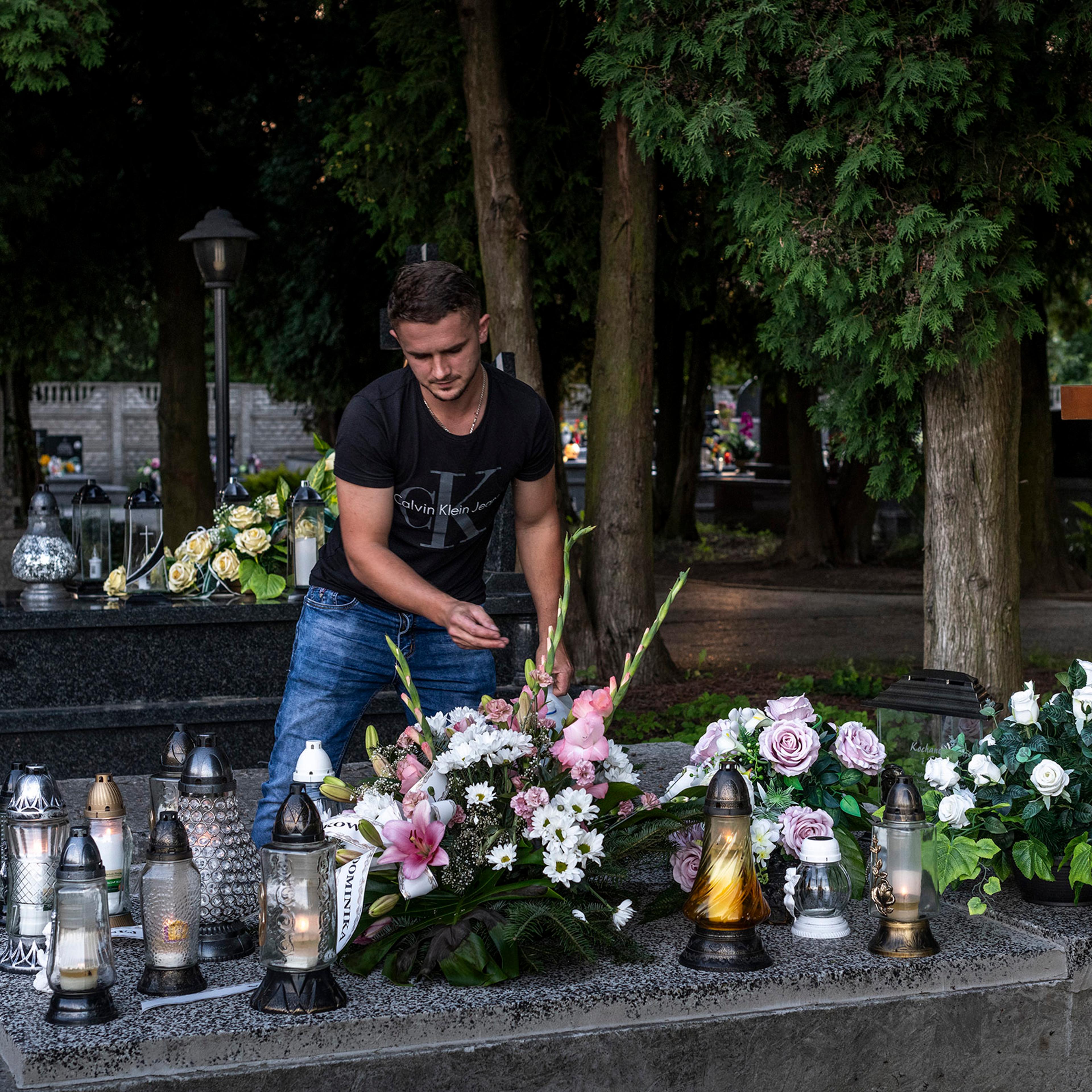 Marcin Lalik visits the grave of his wife Dorota and their son every day after work.