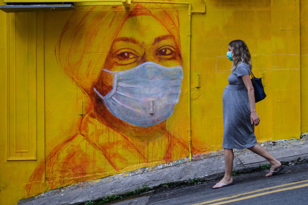 pregnant woman wearing a face mask