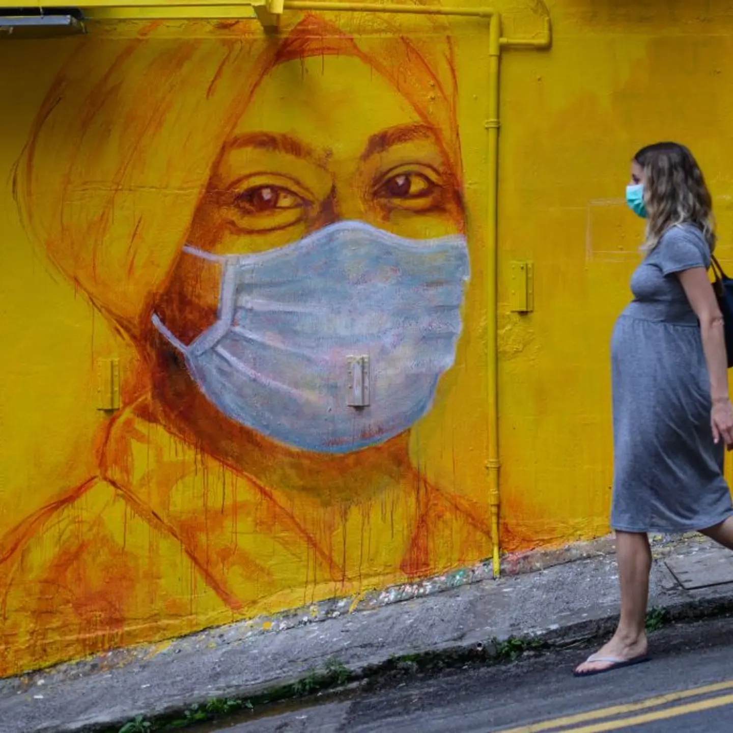 pregnant woman wearing a face mask
