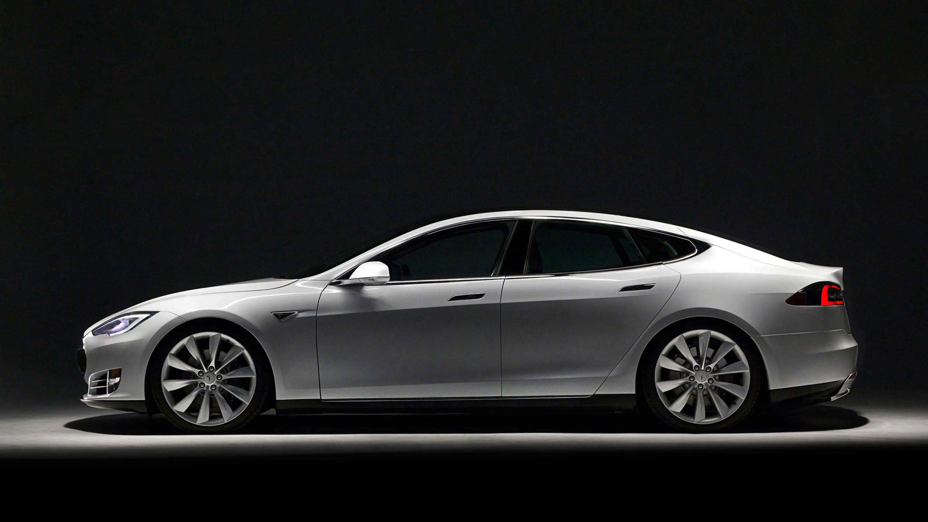 Tesla 2014 Model S Tesla 2014 Model S has been praised both for its luxury feel and high-tech interior. The electric car offers instantaneous acceleration from a stop, a function very few other cars on the market provide.