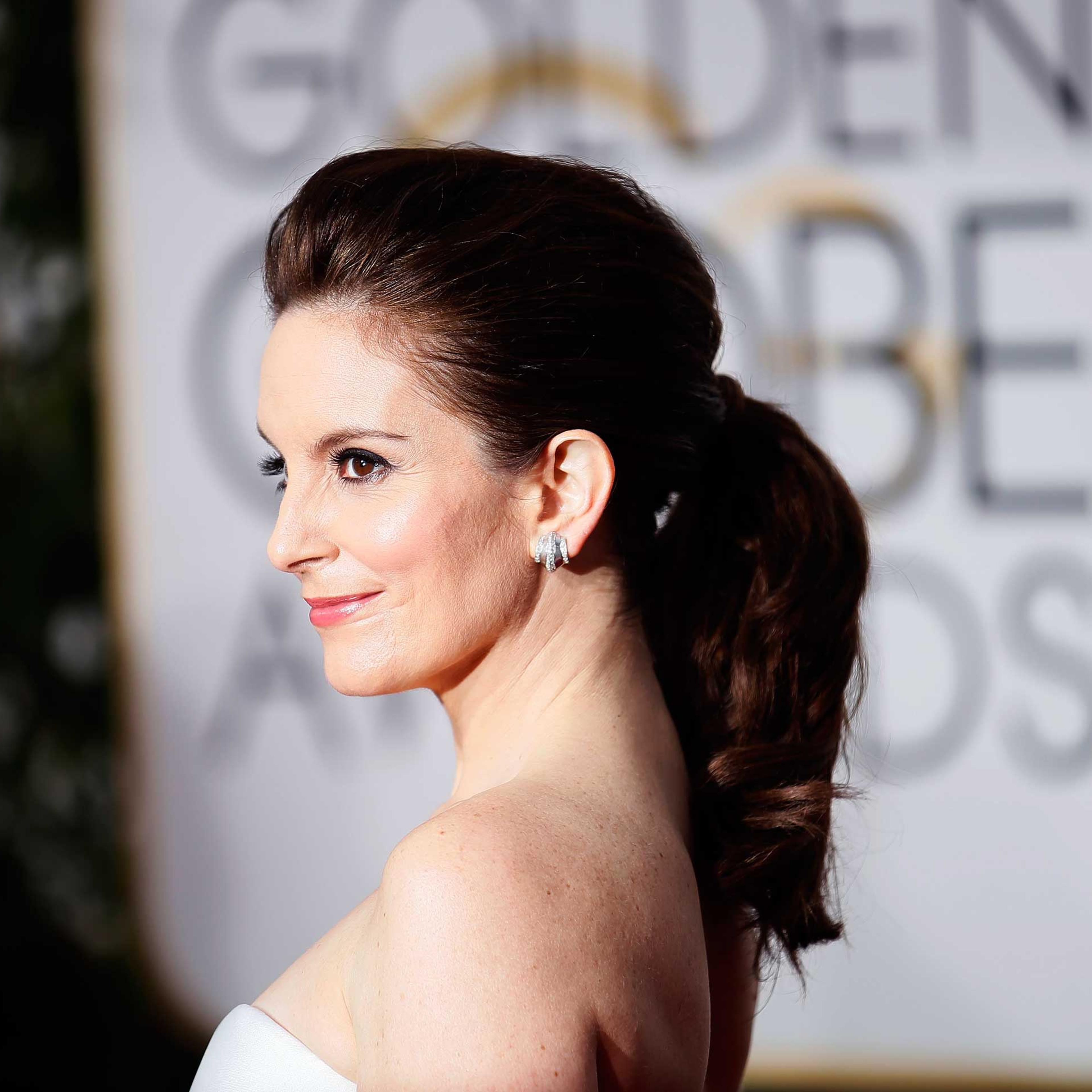 Tina Fey arrives at the 72nd Golden Globe Awards in Beverly Hills, California, Jan. 11, 2015.