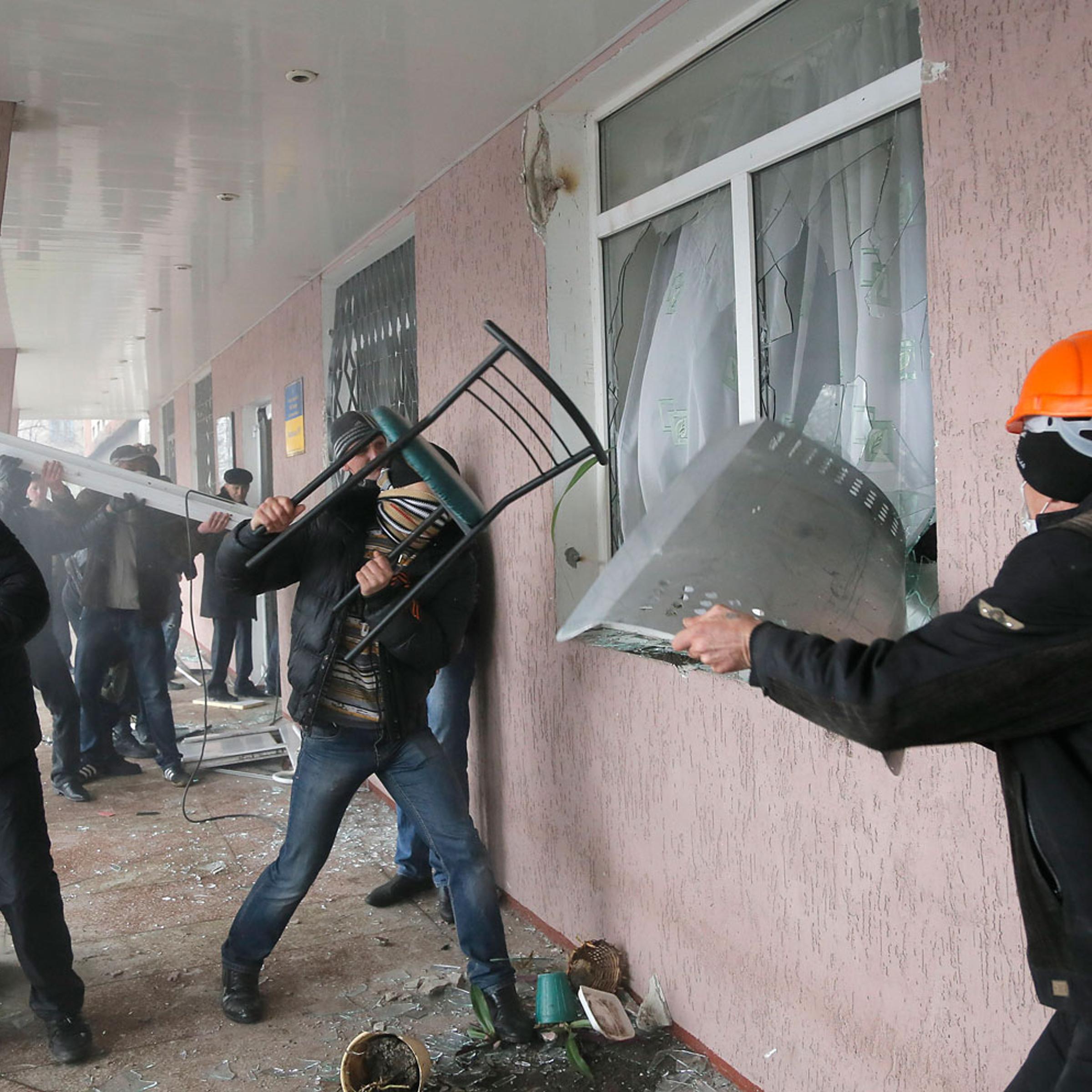 Pro-Russian men storm a police station in the eastern Ukrainian town of Horlivka on April 14, 2014.