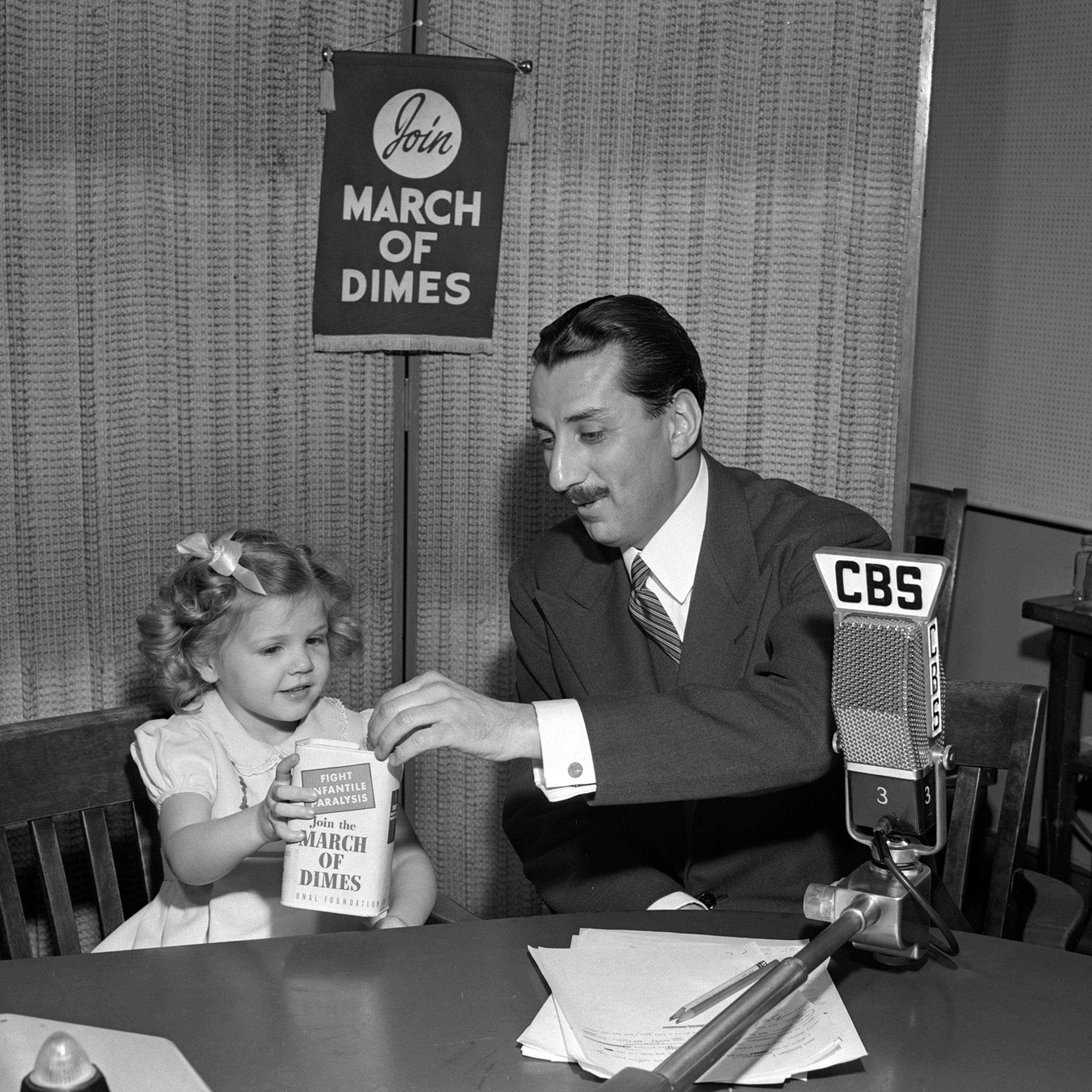CBS Newsman Robert Trout with Nancy Drury, polio survivor and poster child for the March of Dimes on January 15, 1947.