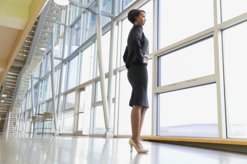 businesswoman-looking-out-window
