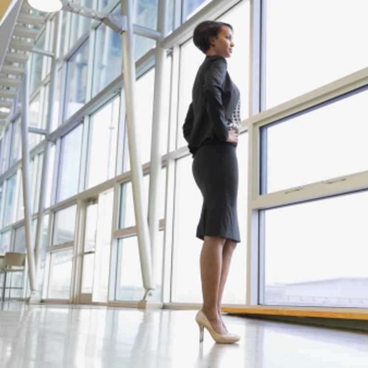 businesswoman-looking-out-window