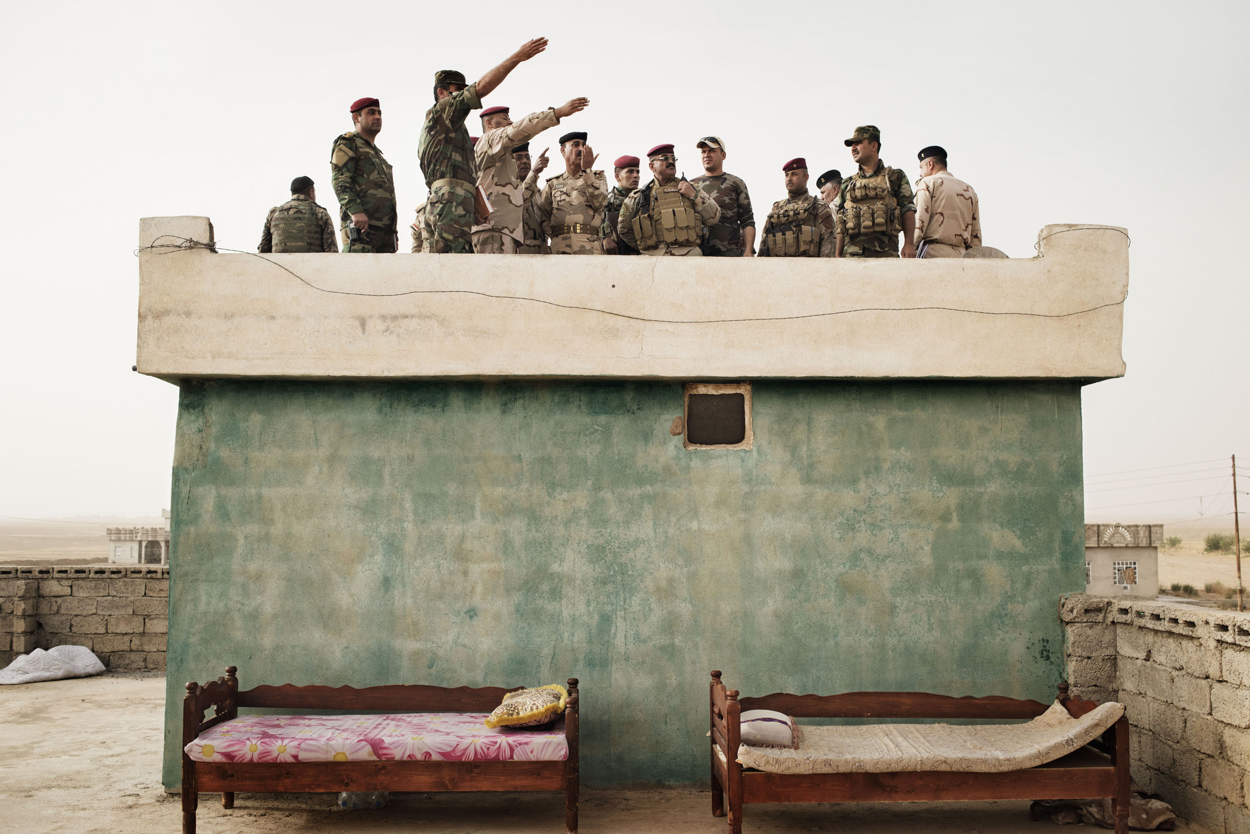 Iraqi Army commanders survey the front line in the villageof Kharbardan, south of Mosul, May 18 2016. The Iraqi military seized the village from ISIS in March, as a part of a grinding march toward the city of Mosul, a major city that has been under ISIS 